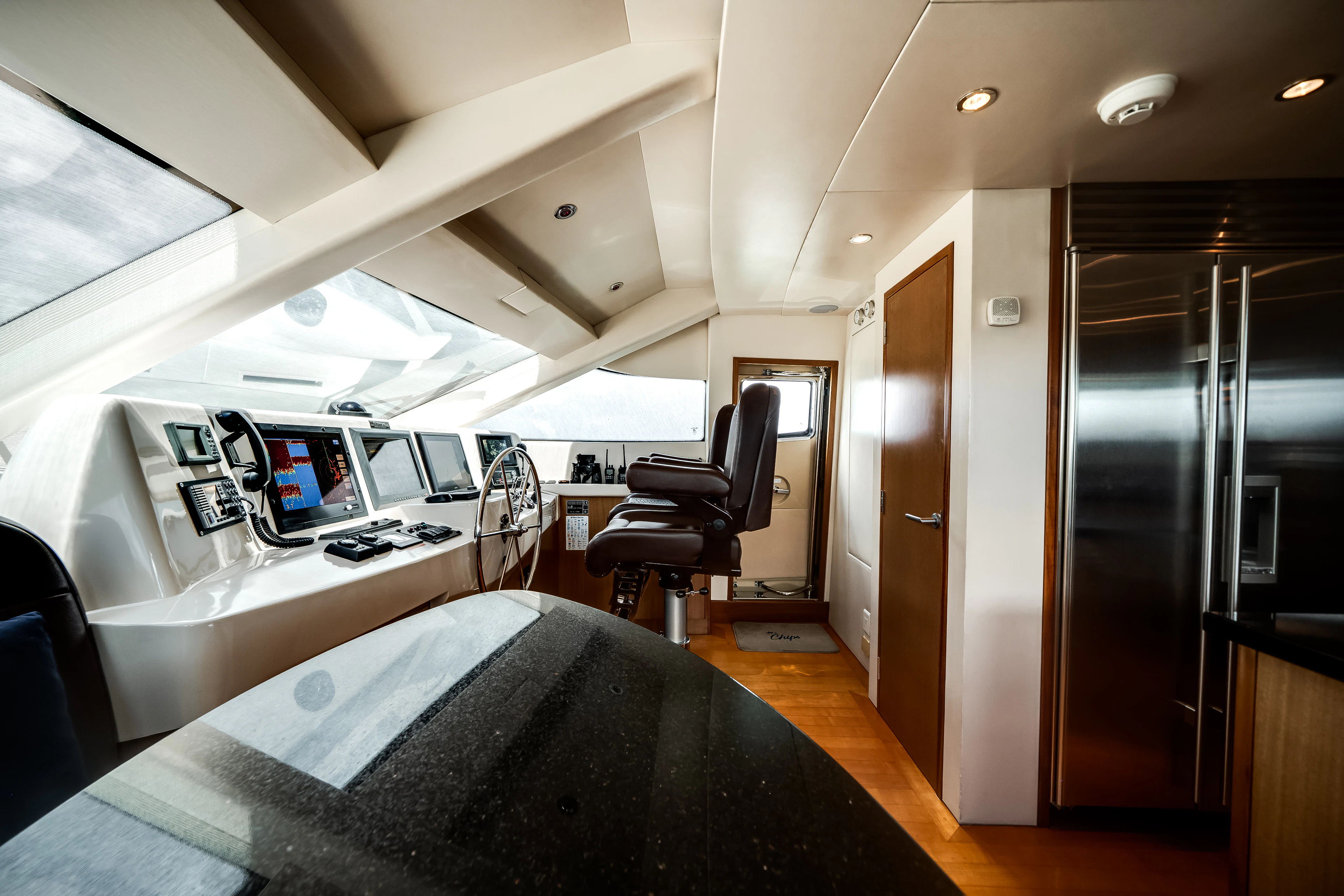 a room with a bed and a desk aboard MR. CHIPS Yacht for Sale