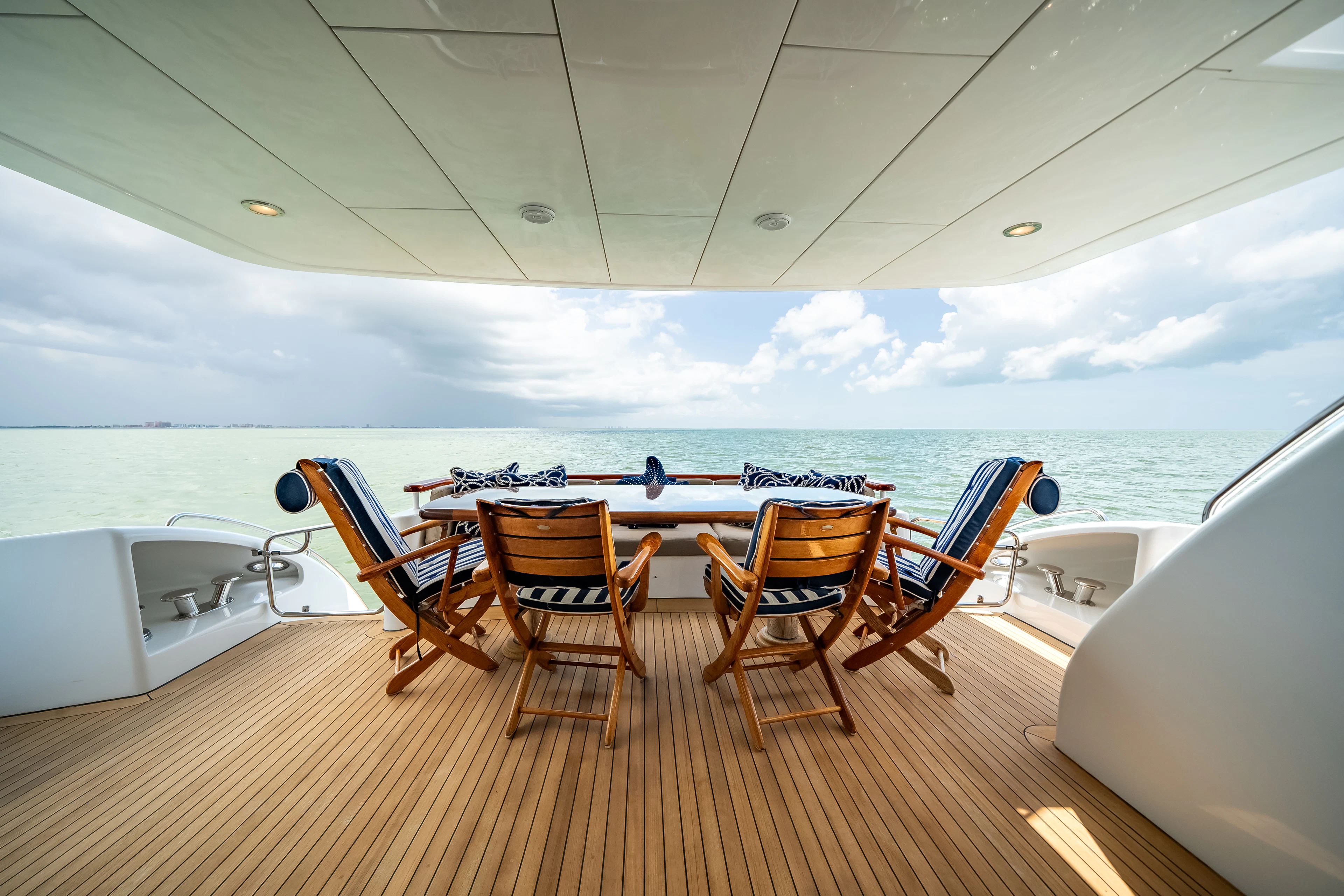 a room with a table and chairs aboard MR. CHIPS Yacht for Sale