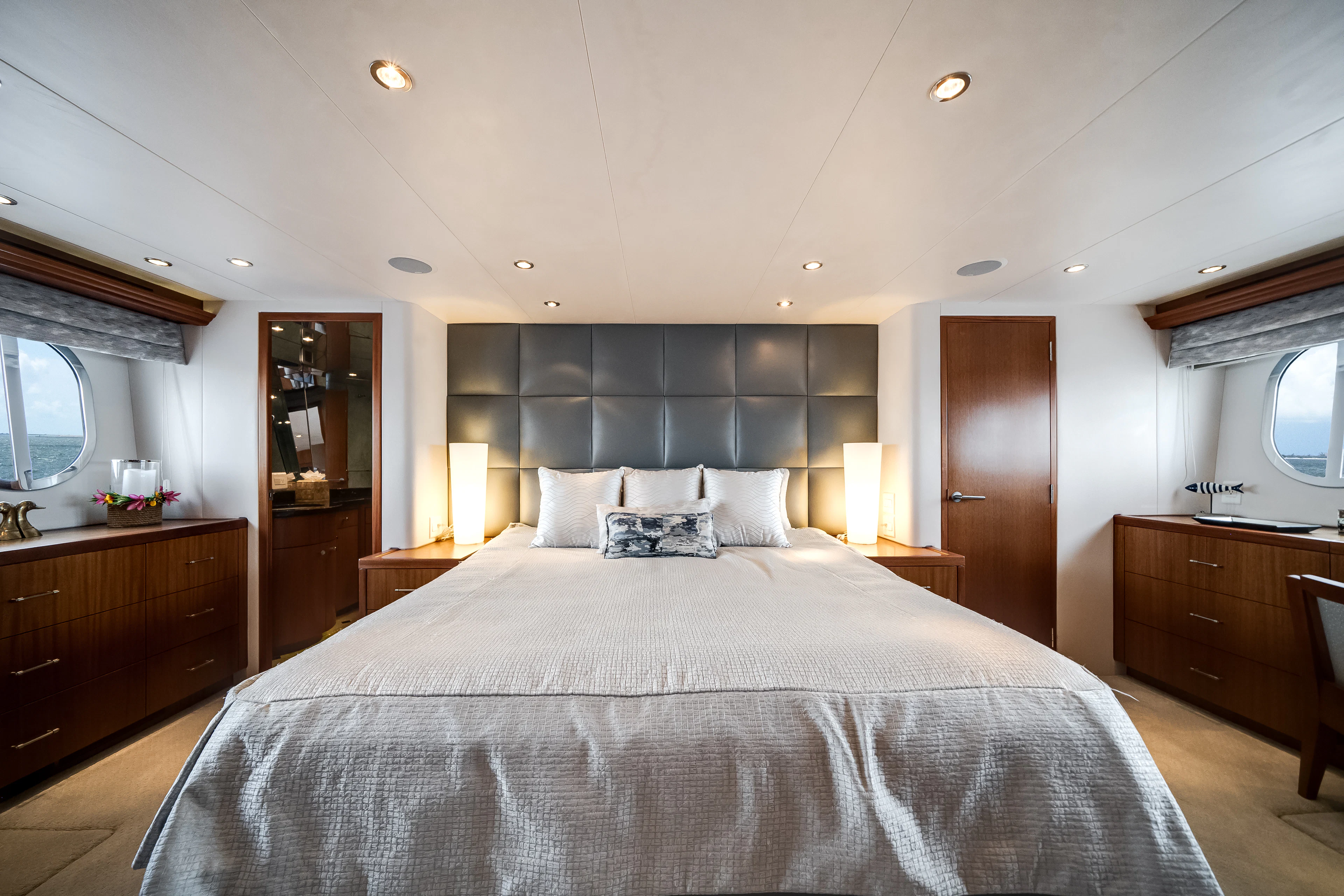a large bed in a hotel room aboard MR. CHIPS Yacht for Sale