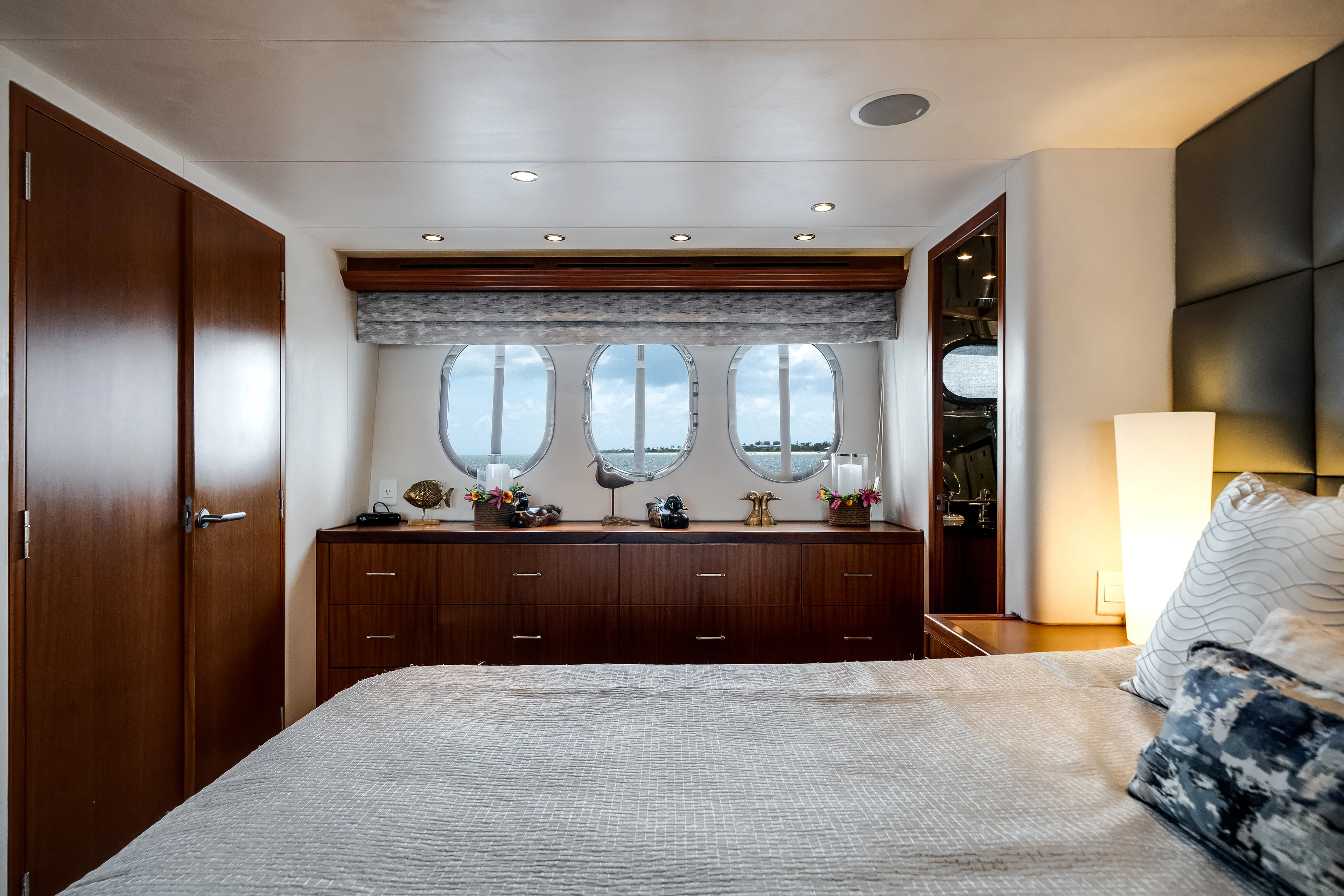 a large bedroom with a large mirror aboard MR. CHIPS Yacht for Sale
