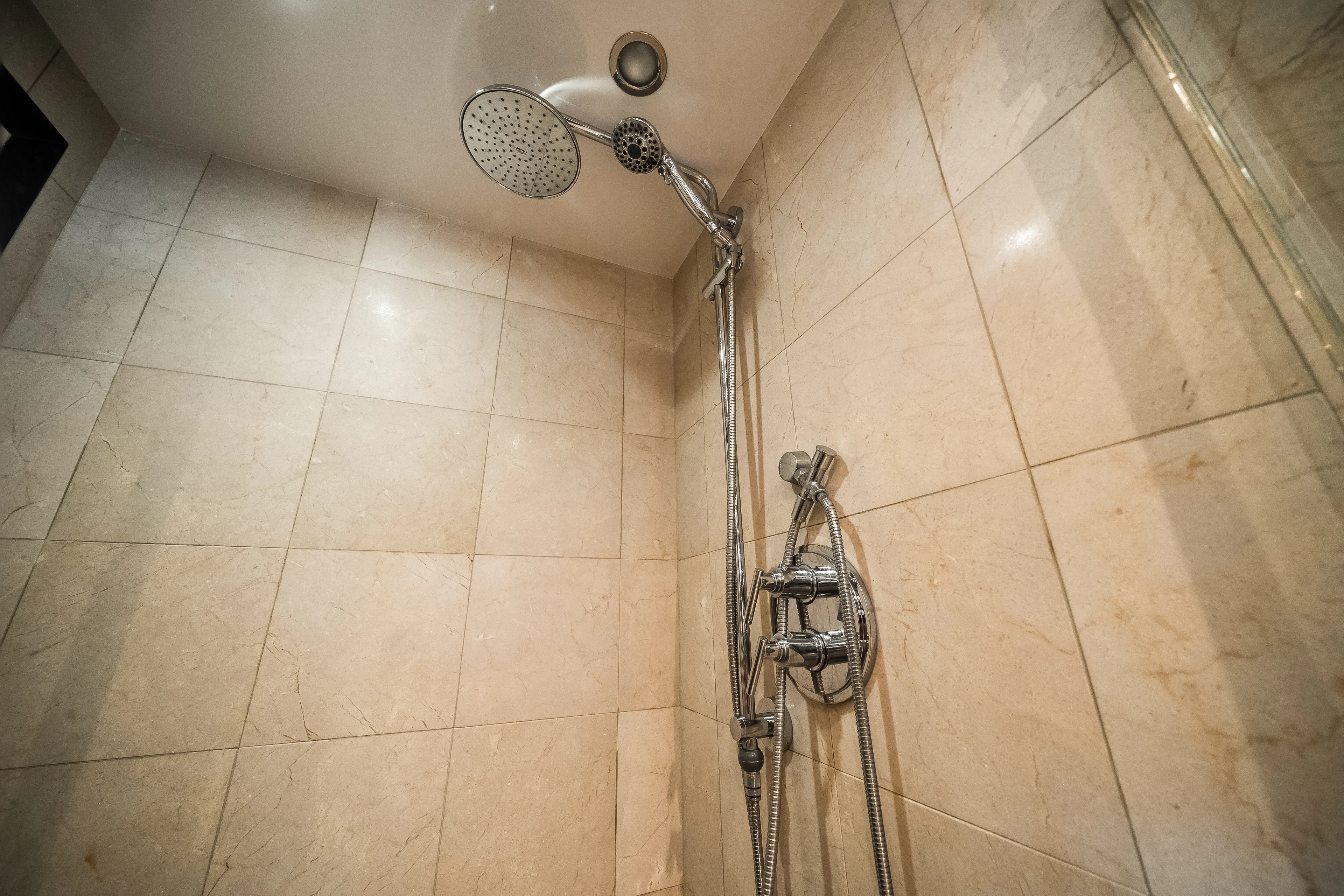 a shower with a tile floor aboard MR. CHIPS Yacht for Sale