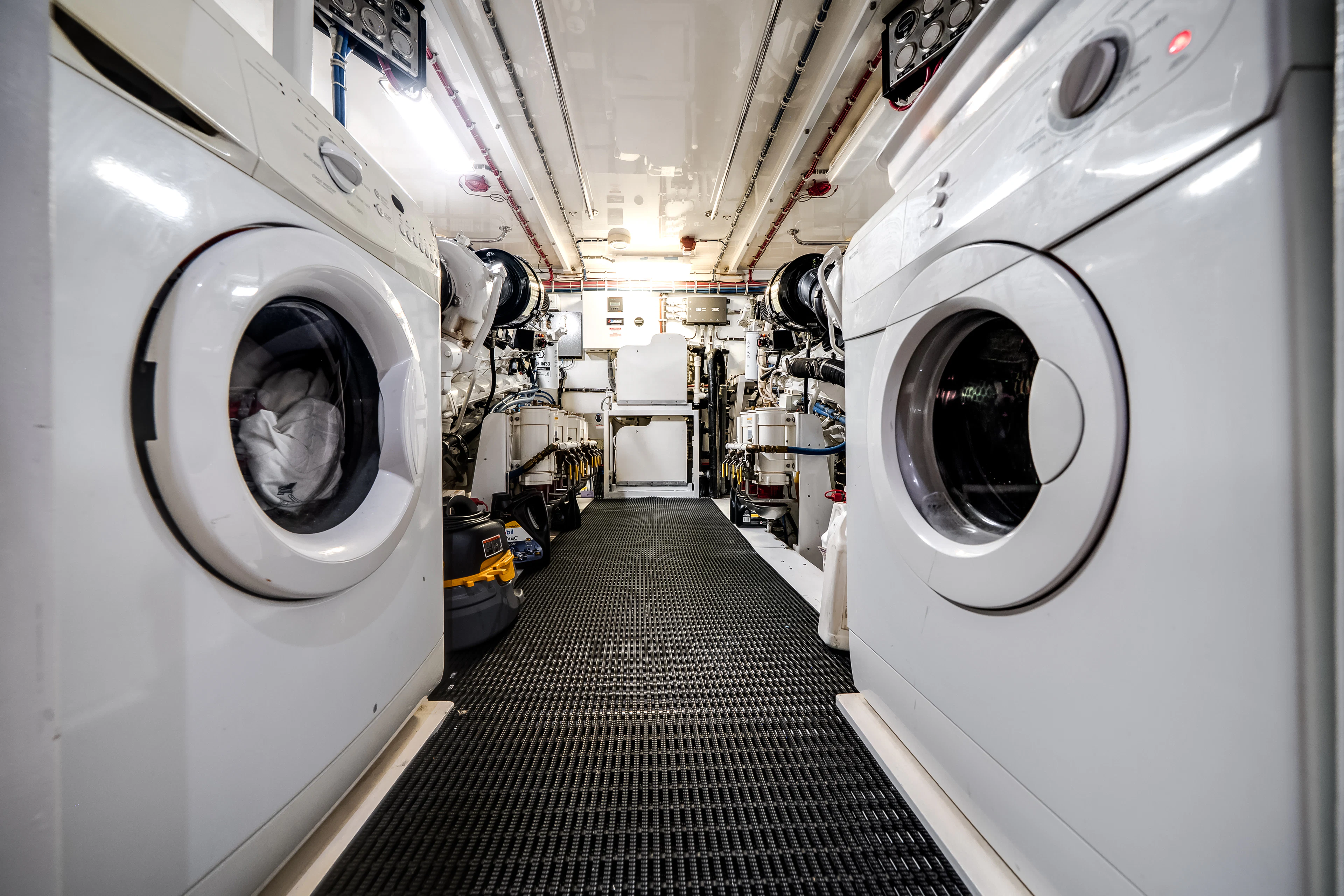 a row of white machines aboard MR. CHIPS Yacht for Sale