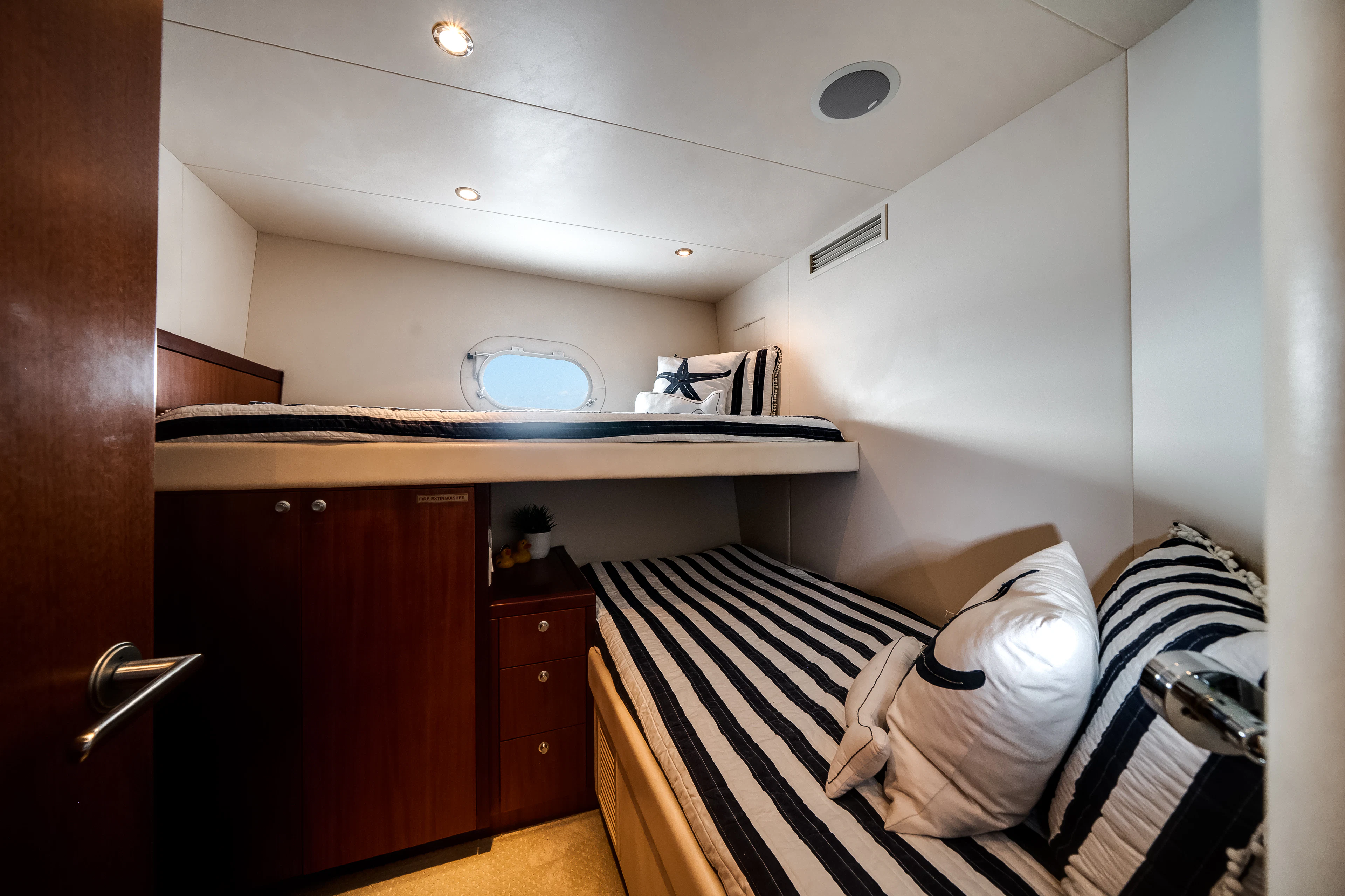 a person lying on a bed aboard MR. CHIPS Yacht for Sale