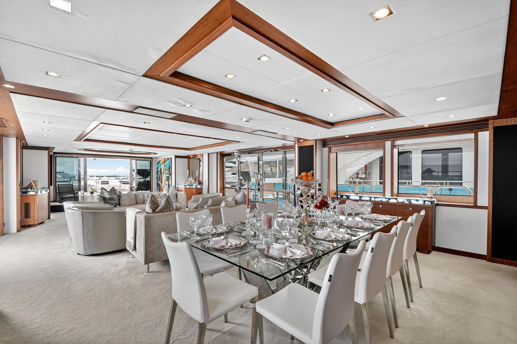 a large dining room with a large table and chairs aboard ABOUT TIME Yacht for Sale