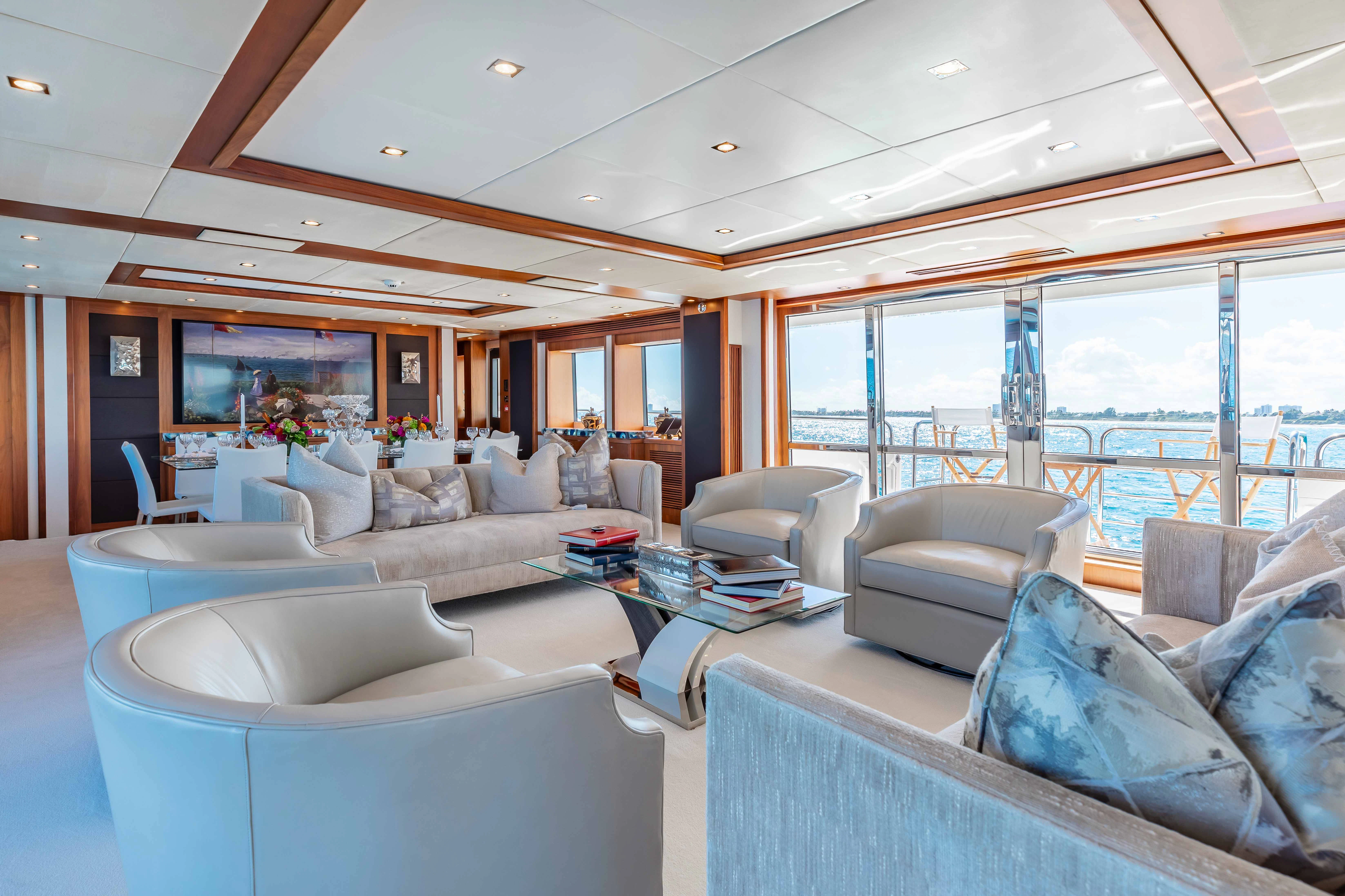 a living room with a large window aboard ABOUT TIME Yacht for Sale