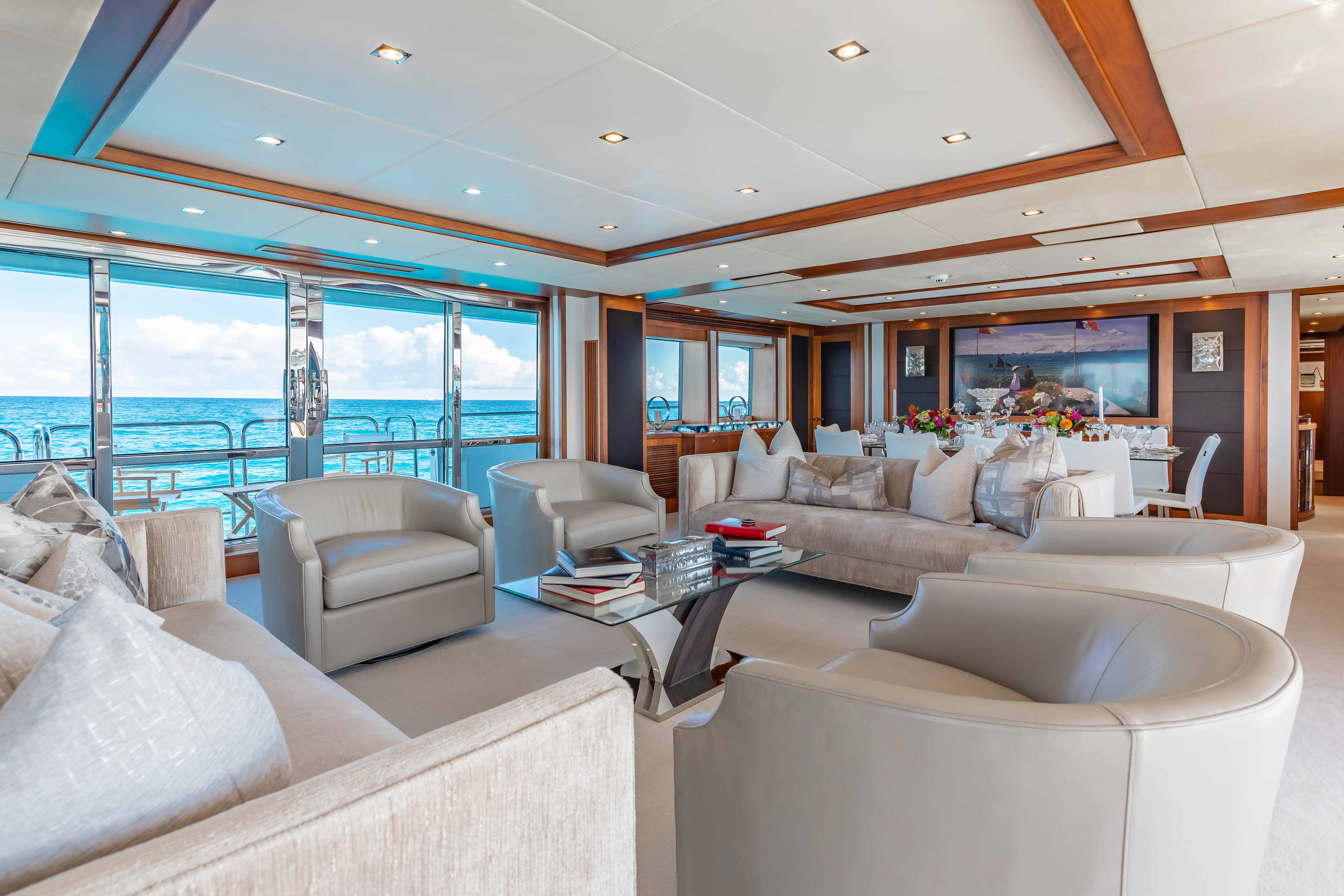 a living room with a large window aboard ABOUT TIME Yacht for Sale