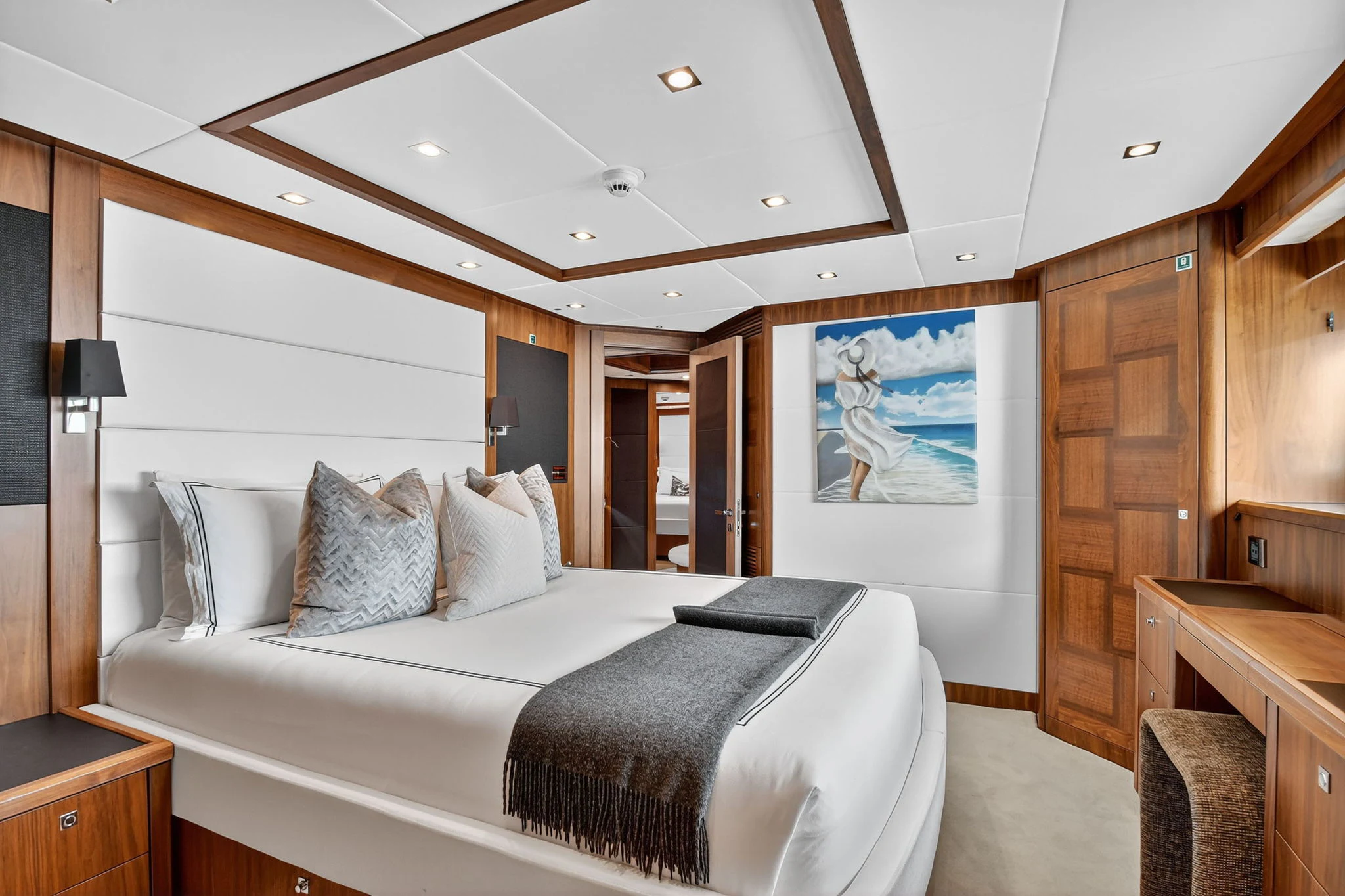 a large bedroom with a large bed aboard ABOUT TIME Yacht for Sale