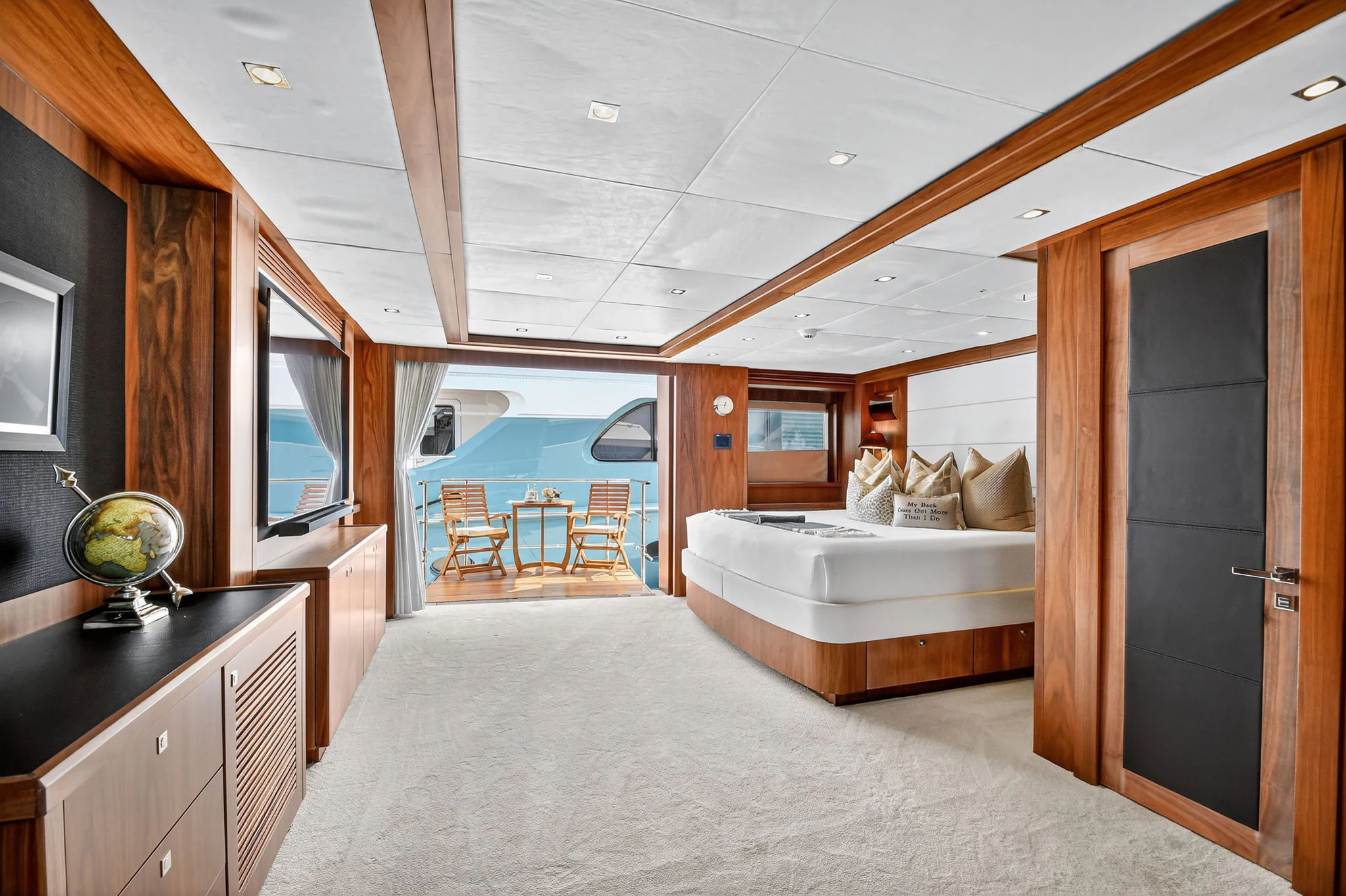 a bedroom with a large bed aboard ABOUT TIME Yacht for Sale