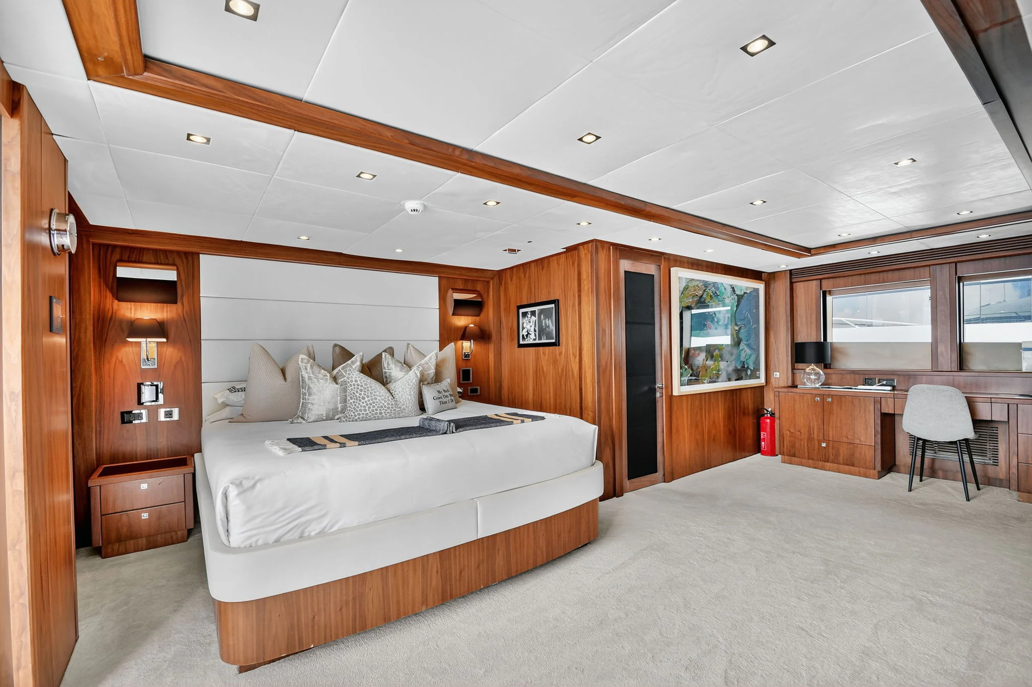 a large bedroom with a bed aboard ABOUT TIME Yacht for Sale