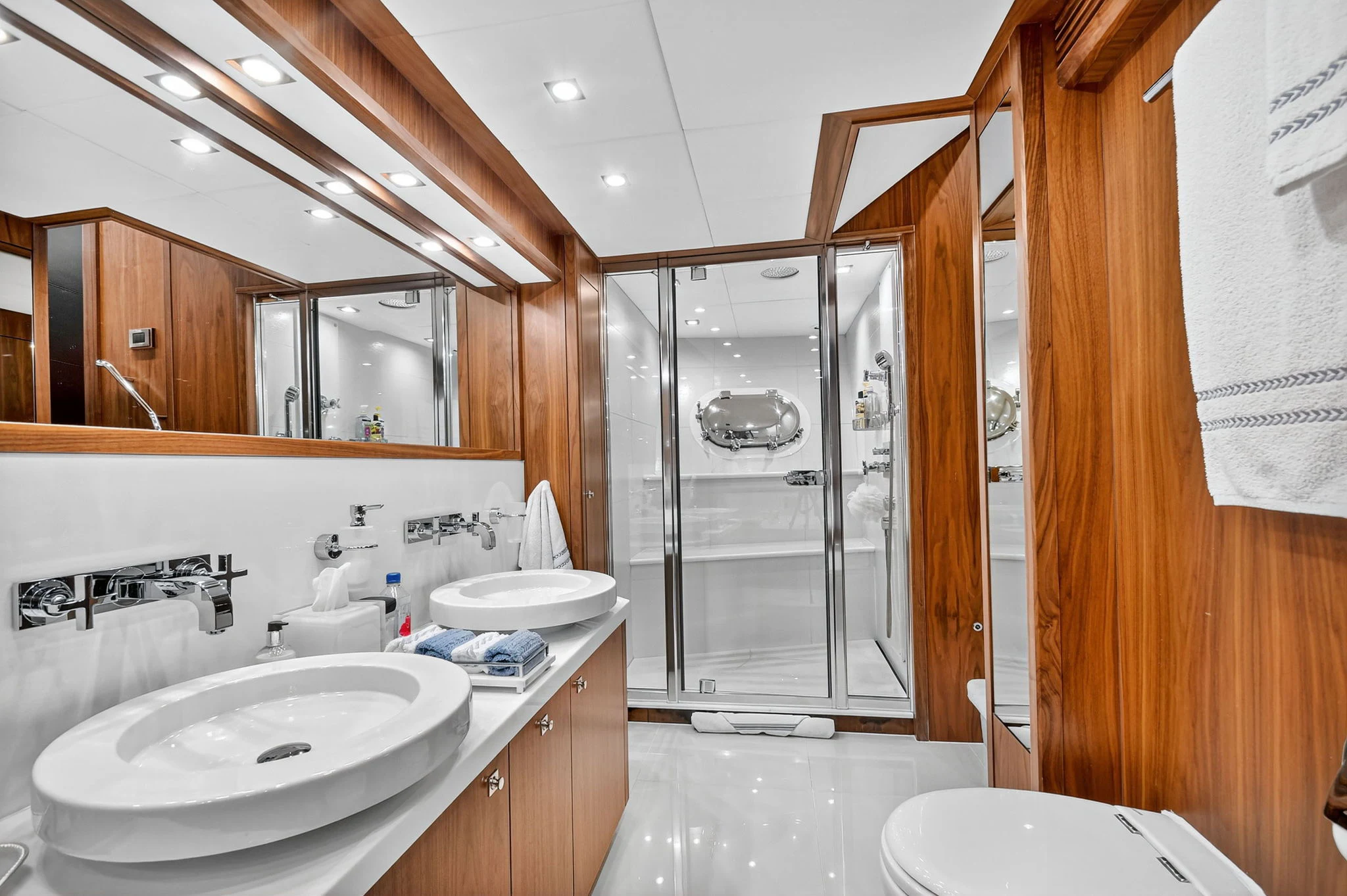 a bathroom with a glass shower aboard ABOUT TIME Yacht for Sale