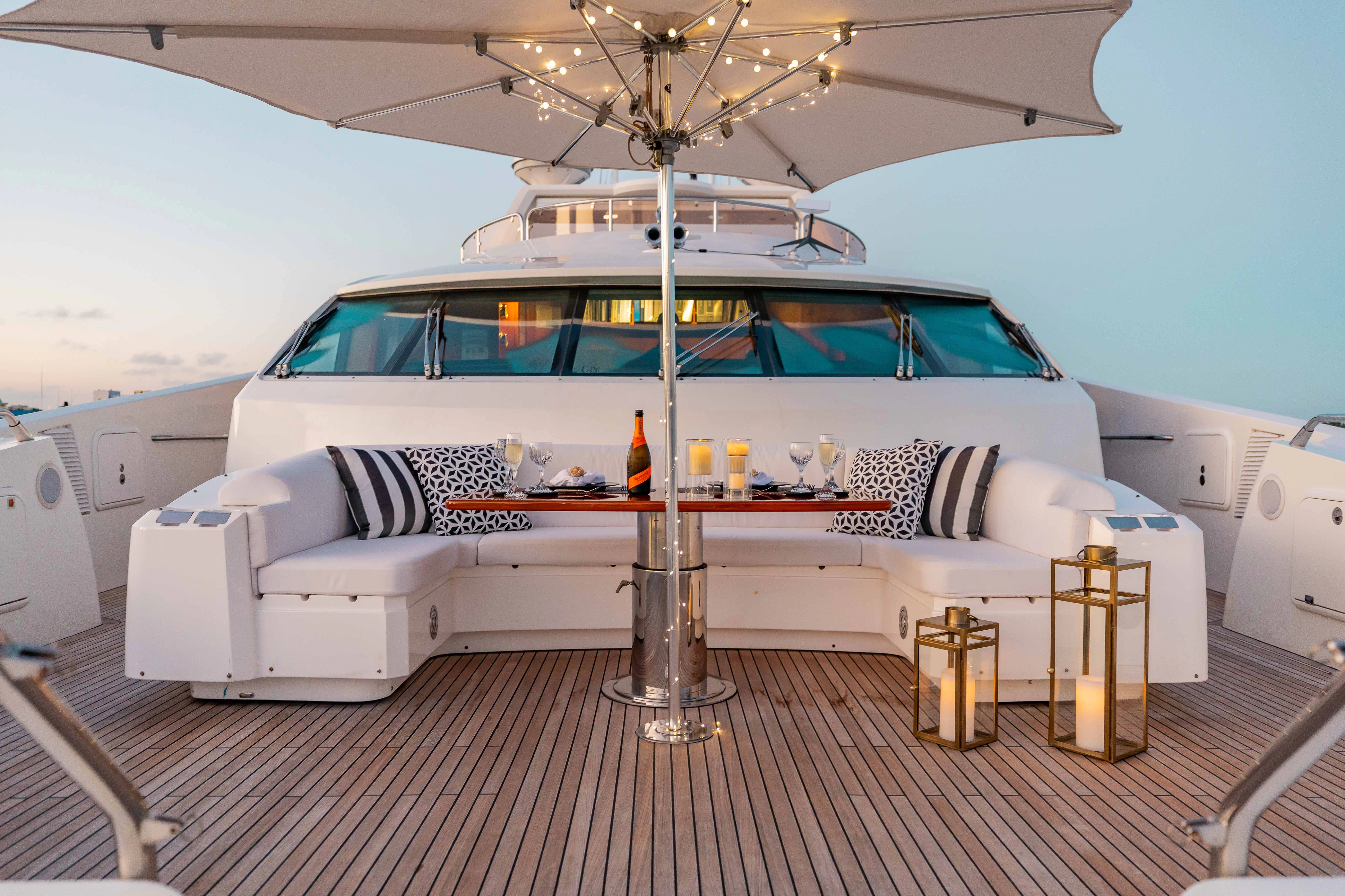 a white boat on a deck aboard ABOUT TIME Yacht for Sale