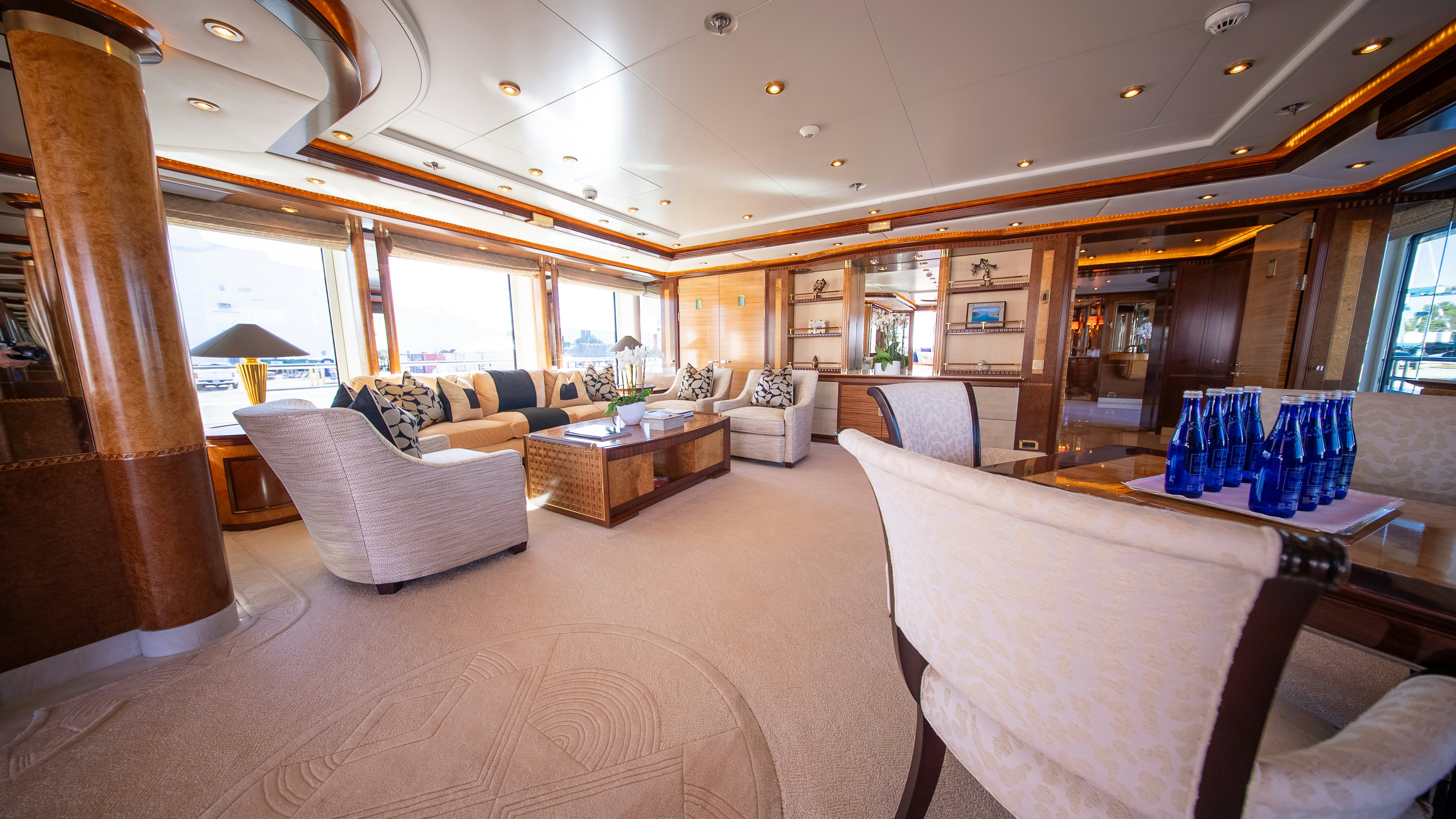 a room with a couch and a table and chairs aboard LUDZIE Yacht for Charter