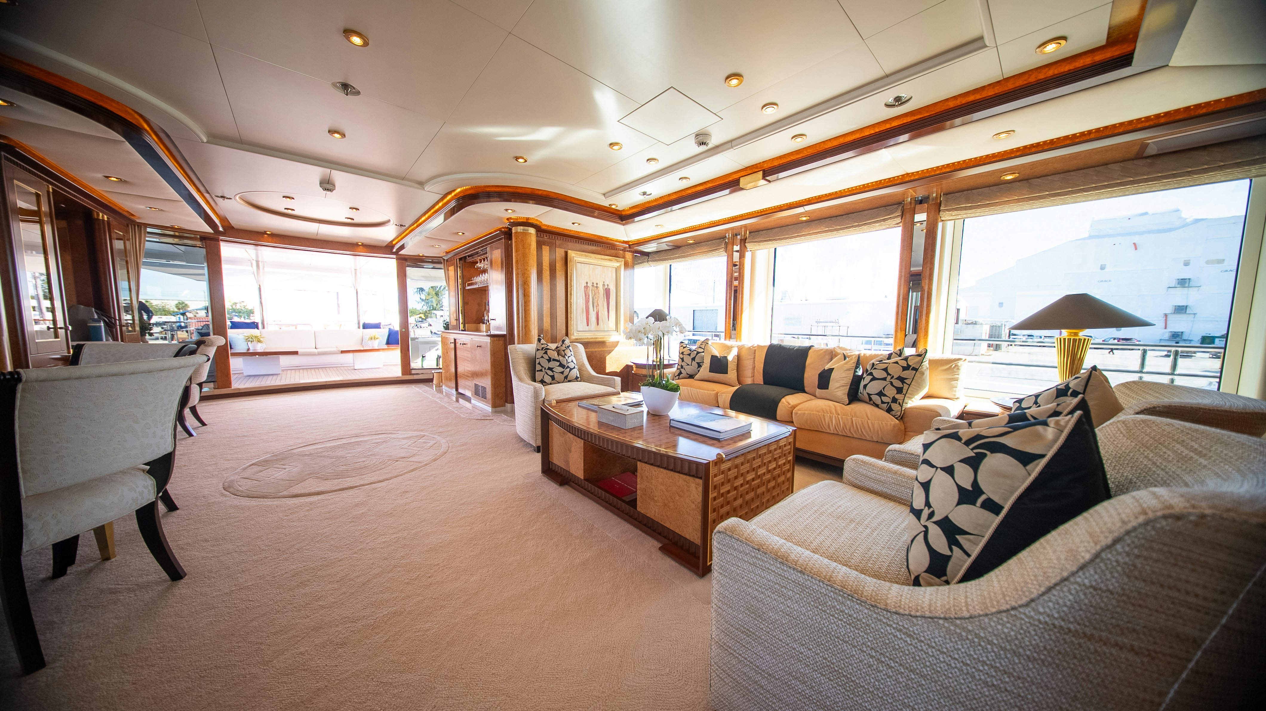 a living room with a large window aboard LUDZIE Yacht for Charter