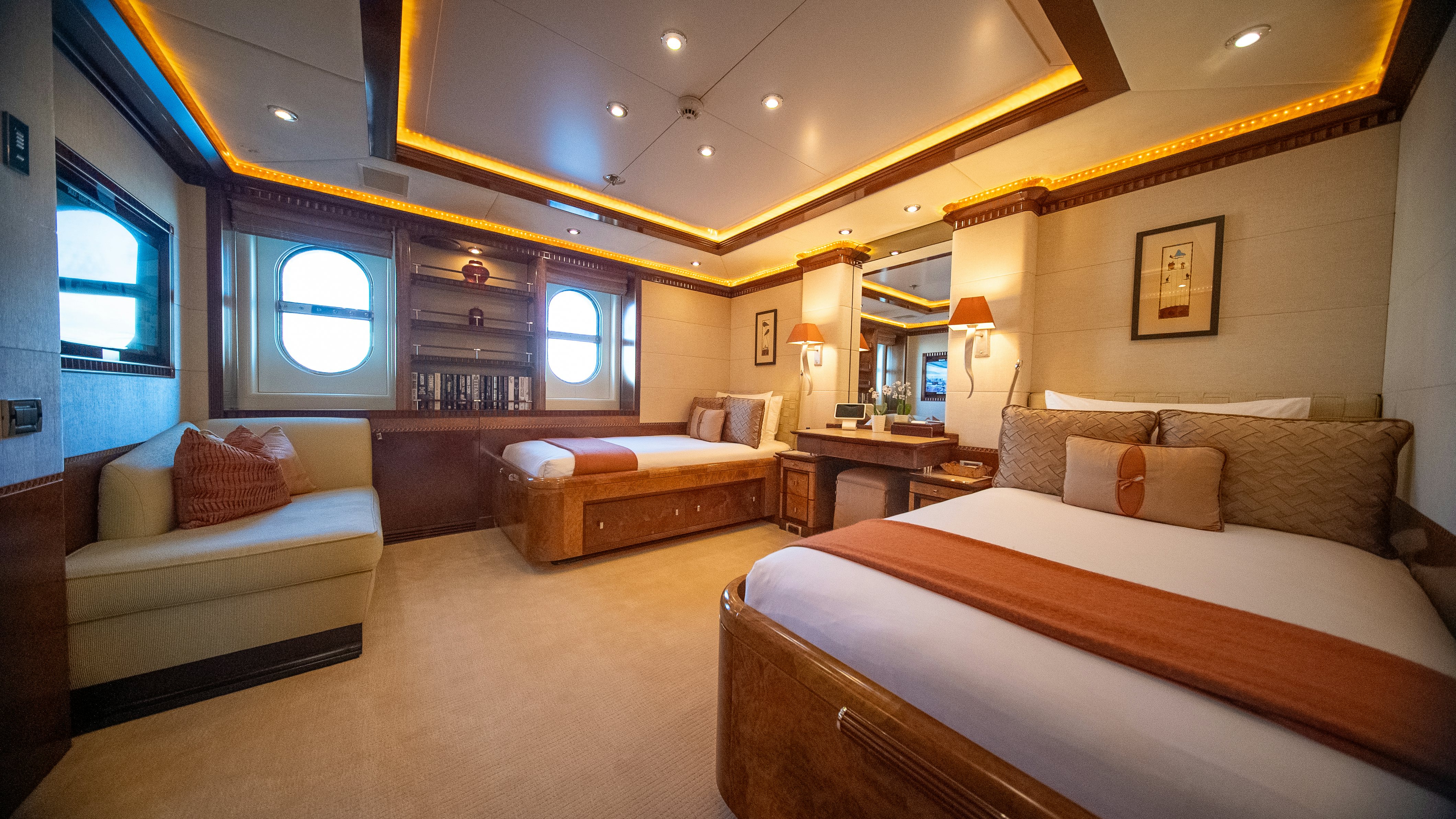 a large bedroom with a bed and a couch aboard LUDZIE Yacht for Charter