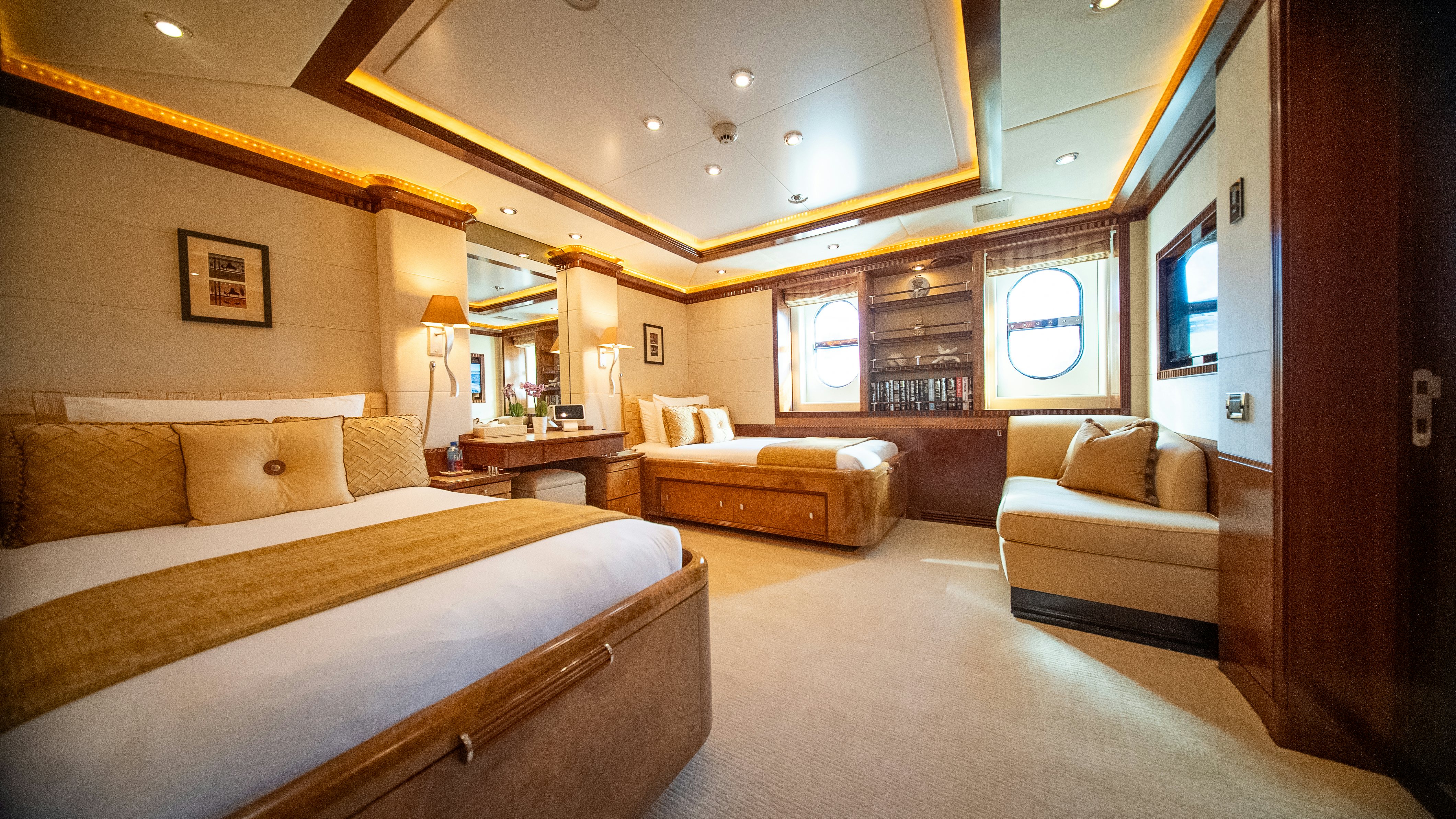 a large bedroom with a bed and a couch aboard LUDZIE Yacht for Charter