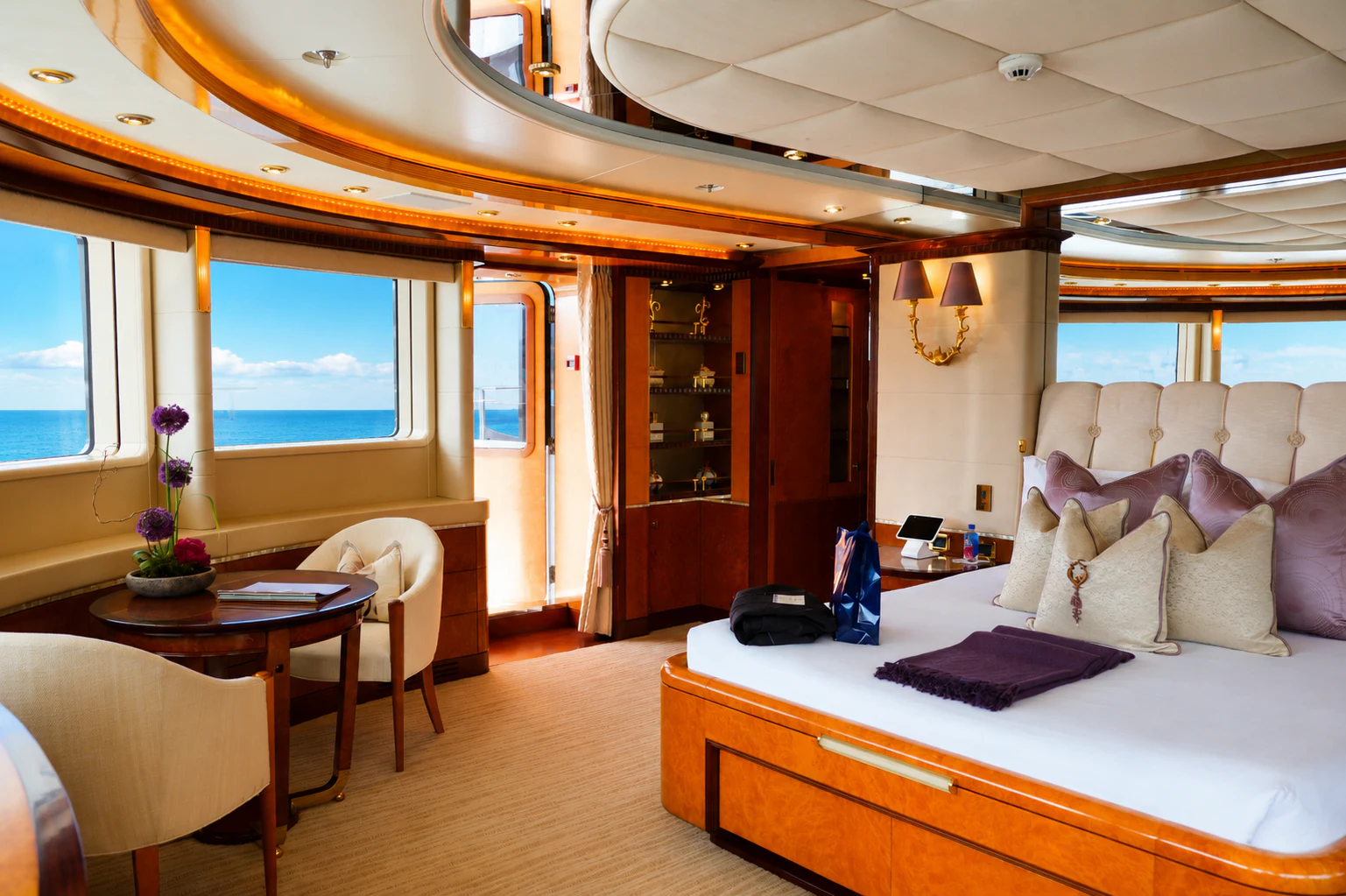 a bedroom with a bed and a table aboard LUDZIE Yacht for Charter