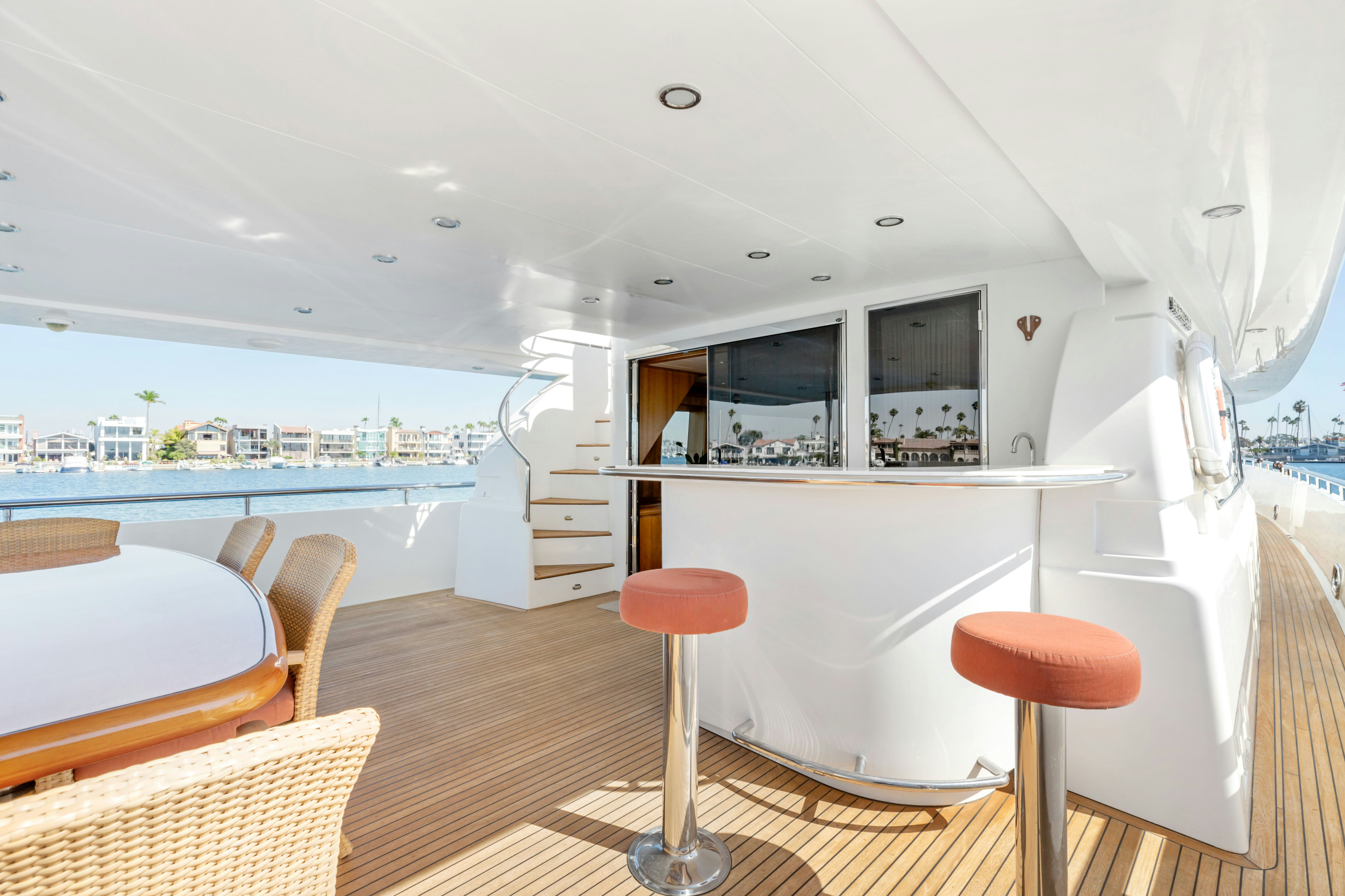 a room with a table chairs and a window aboard REVERIE Yacht for Sale
