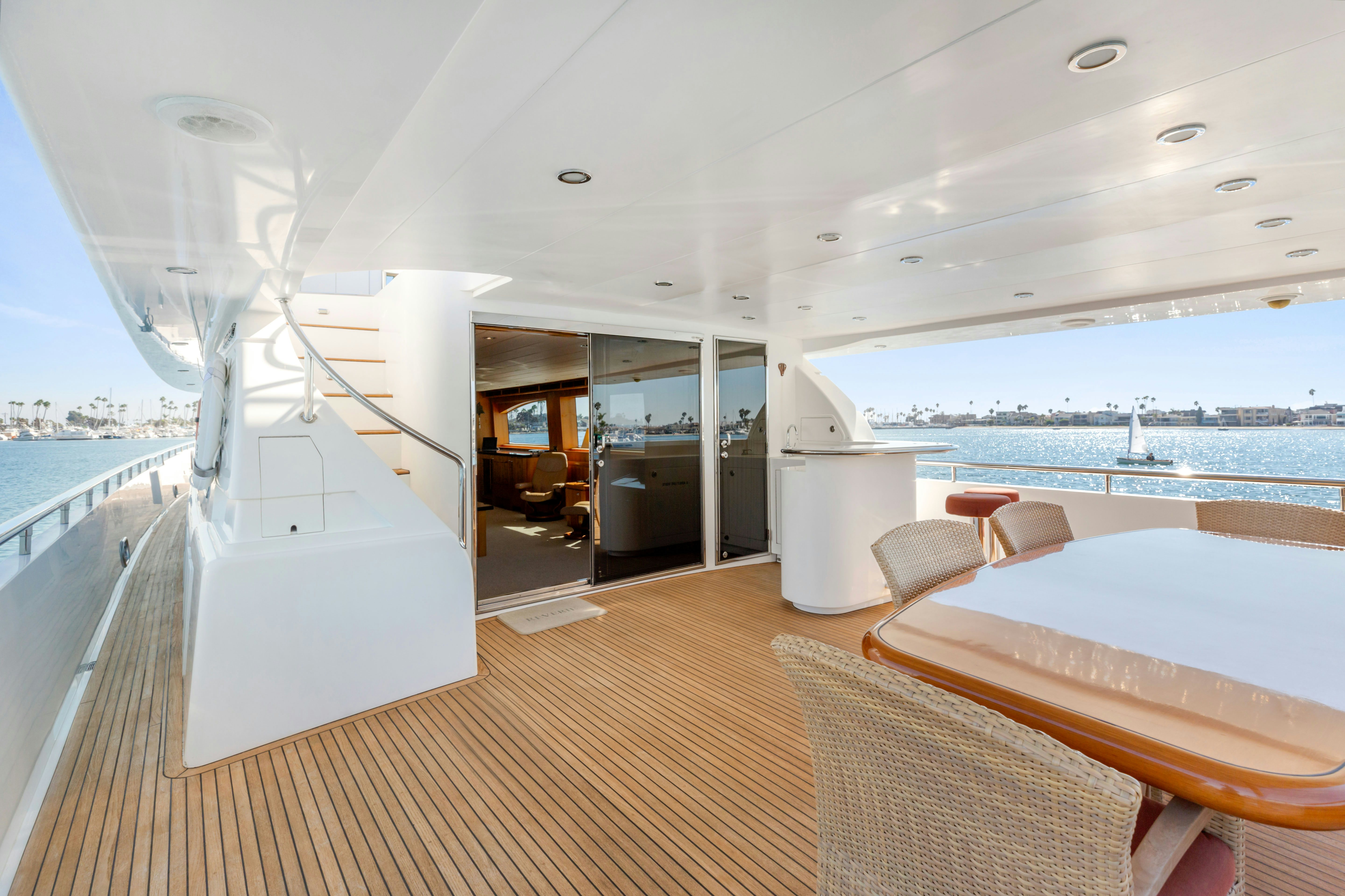 a room with a large window and a view of the water aboard REVERIE Yacht for Sale