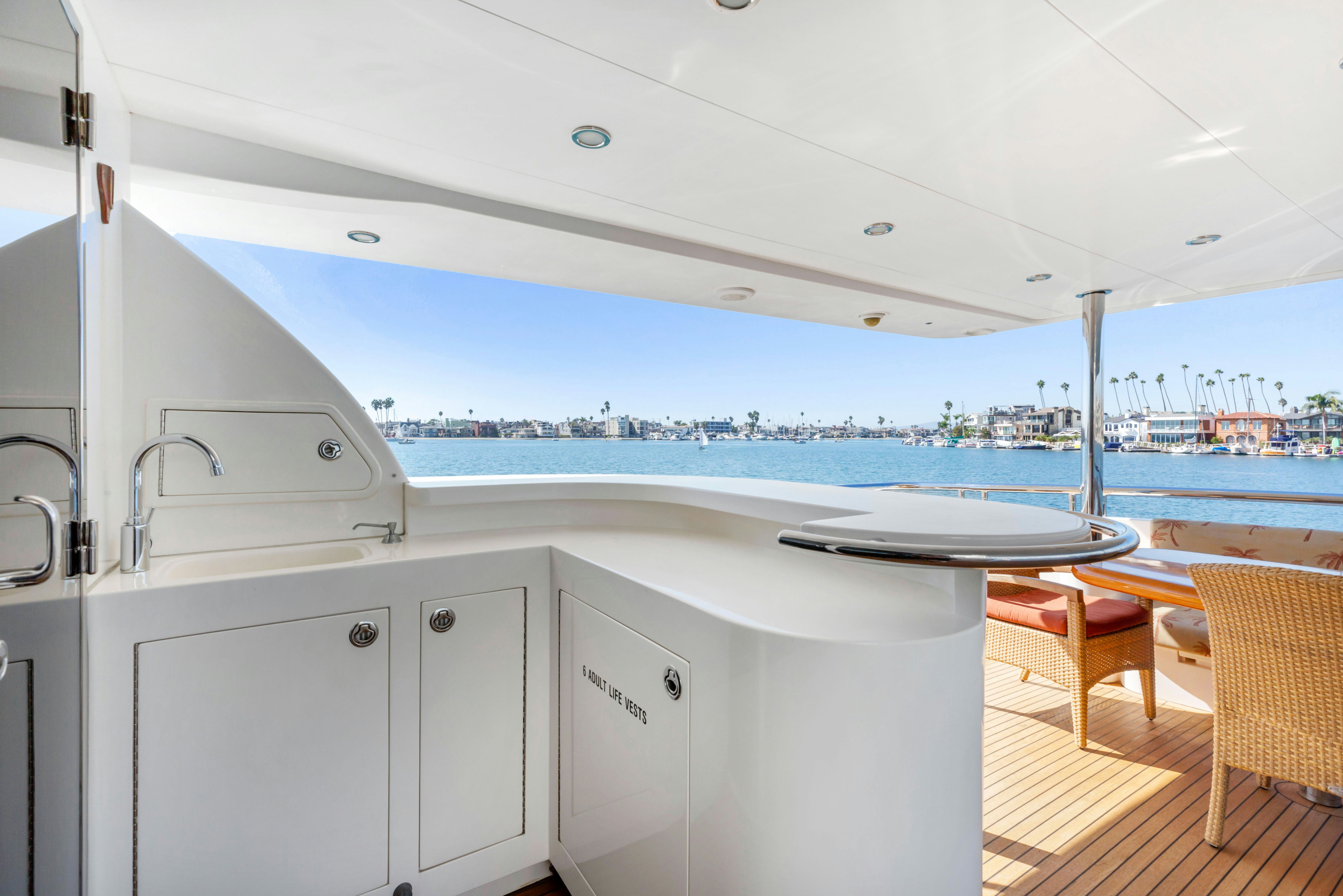 a kitchen with a large window overlooking the ocean aboard REVERIE Yacht for Sale