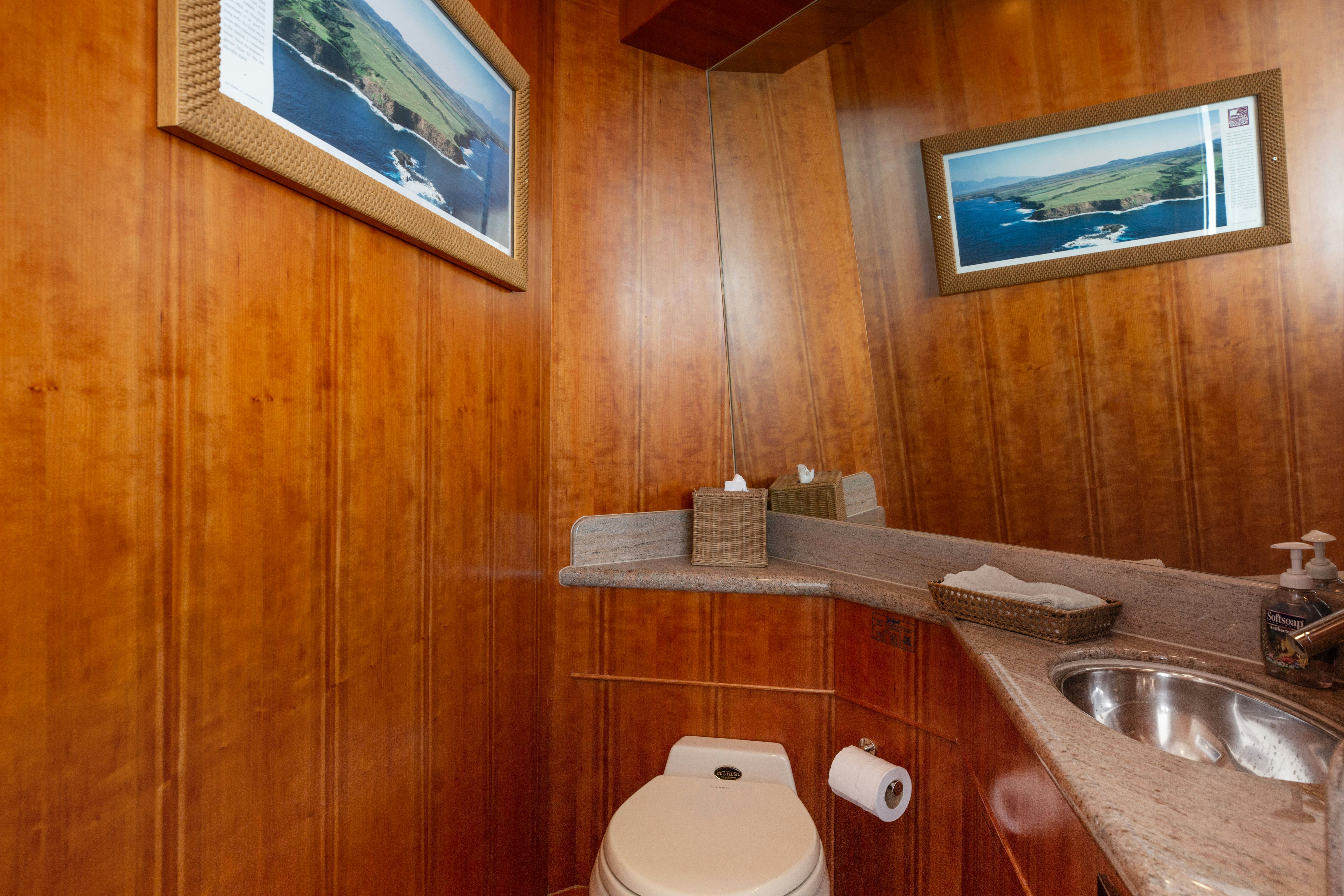 a bathroom with wooden walls aboard REVERIE Yacht for Sale