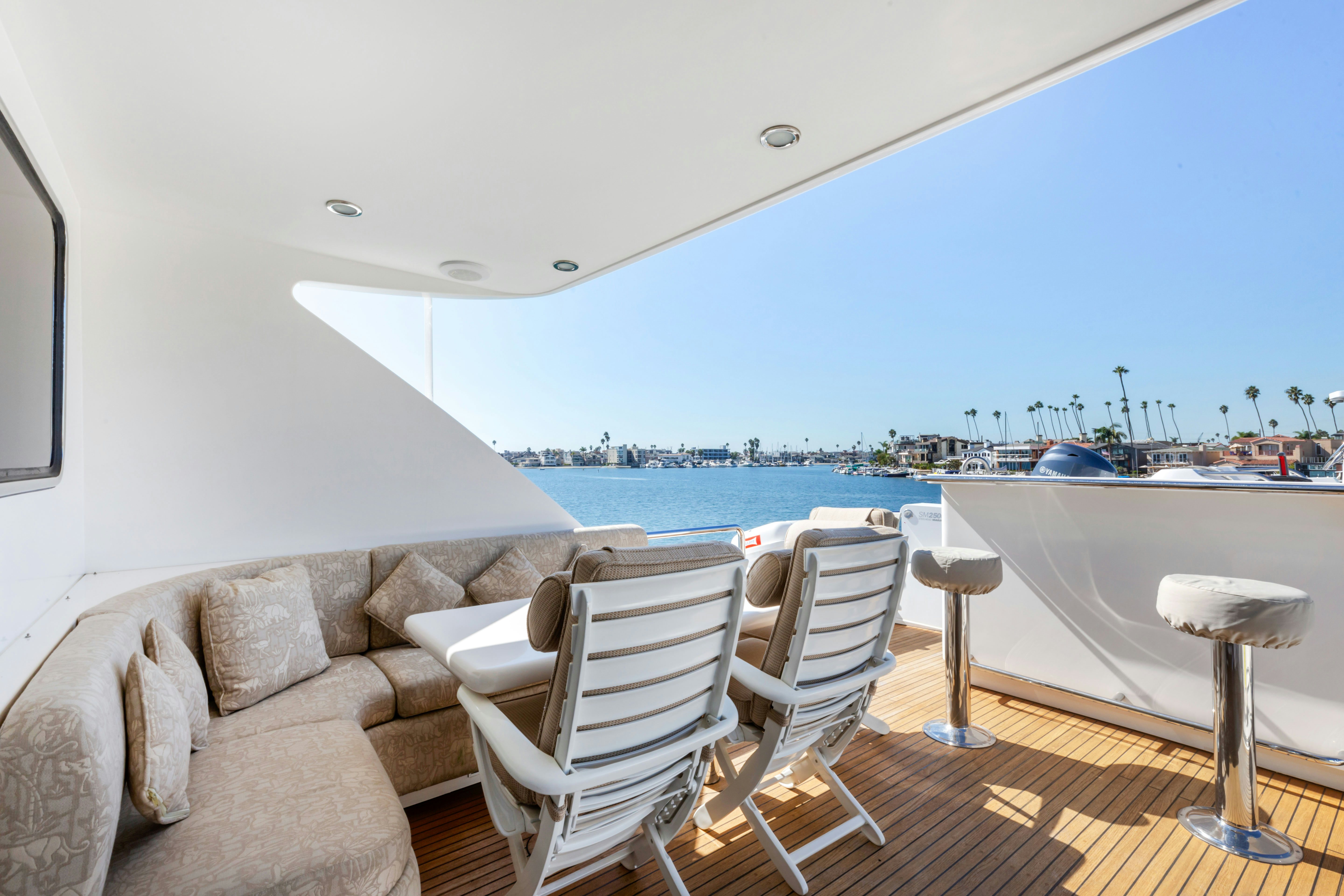a living room with a couch and a table and chairs aboard REVERIE Yacht for Sale
