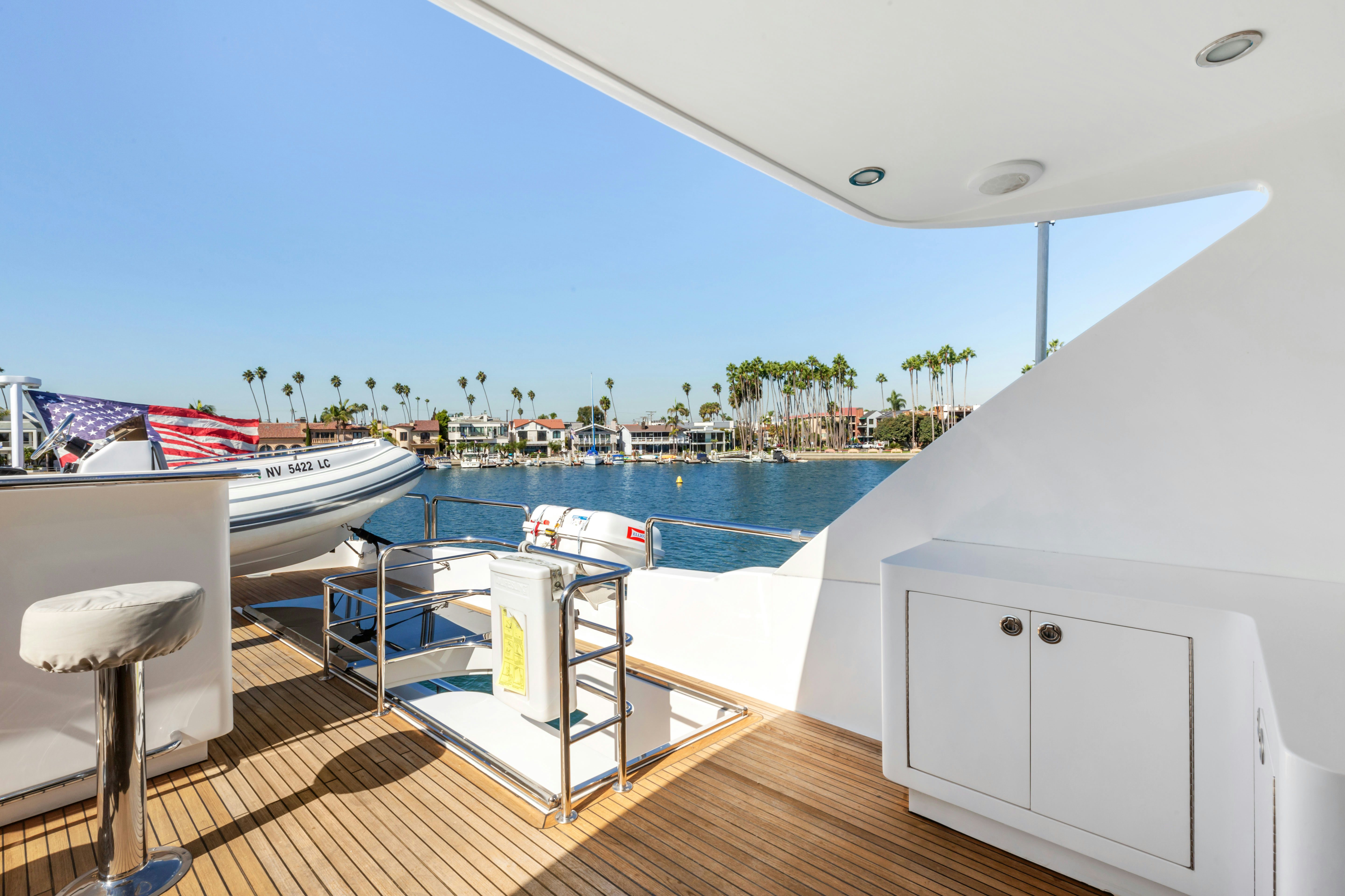 a deck with a pool and boats aboard REVERIE Yacht for Sale