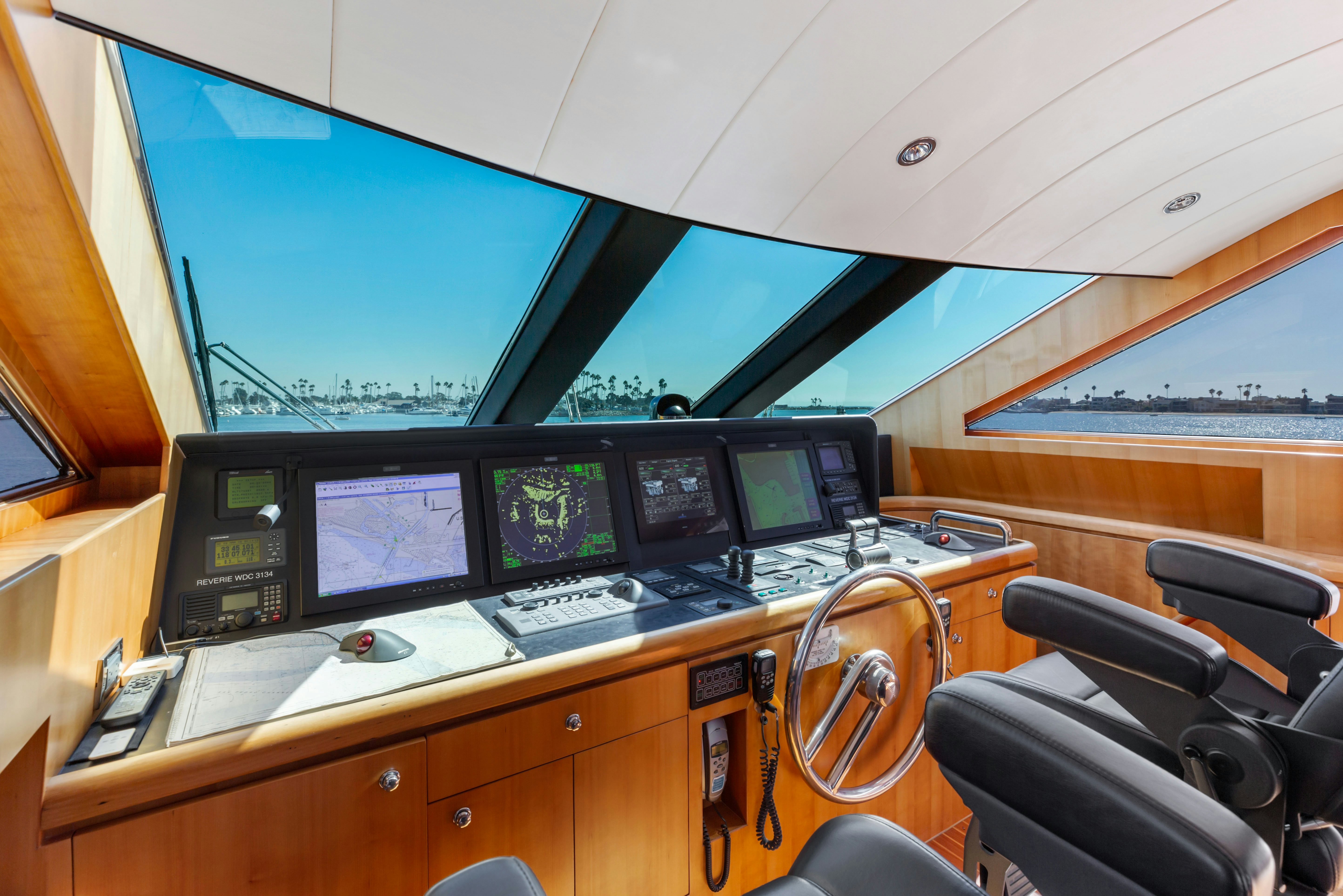 a control room with several monitors aboard REVERIE Yacht for Sale