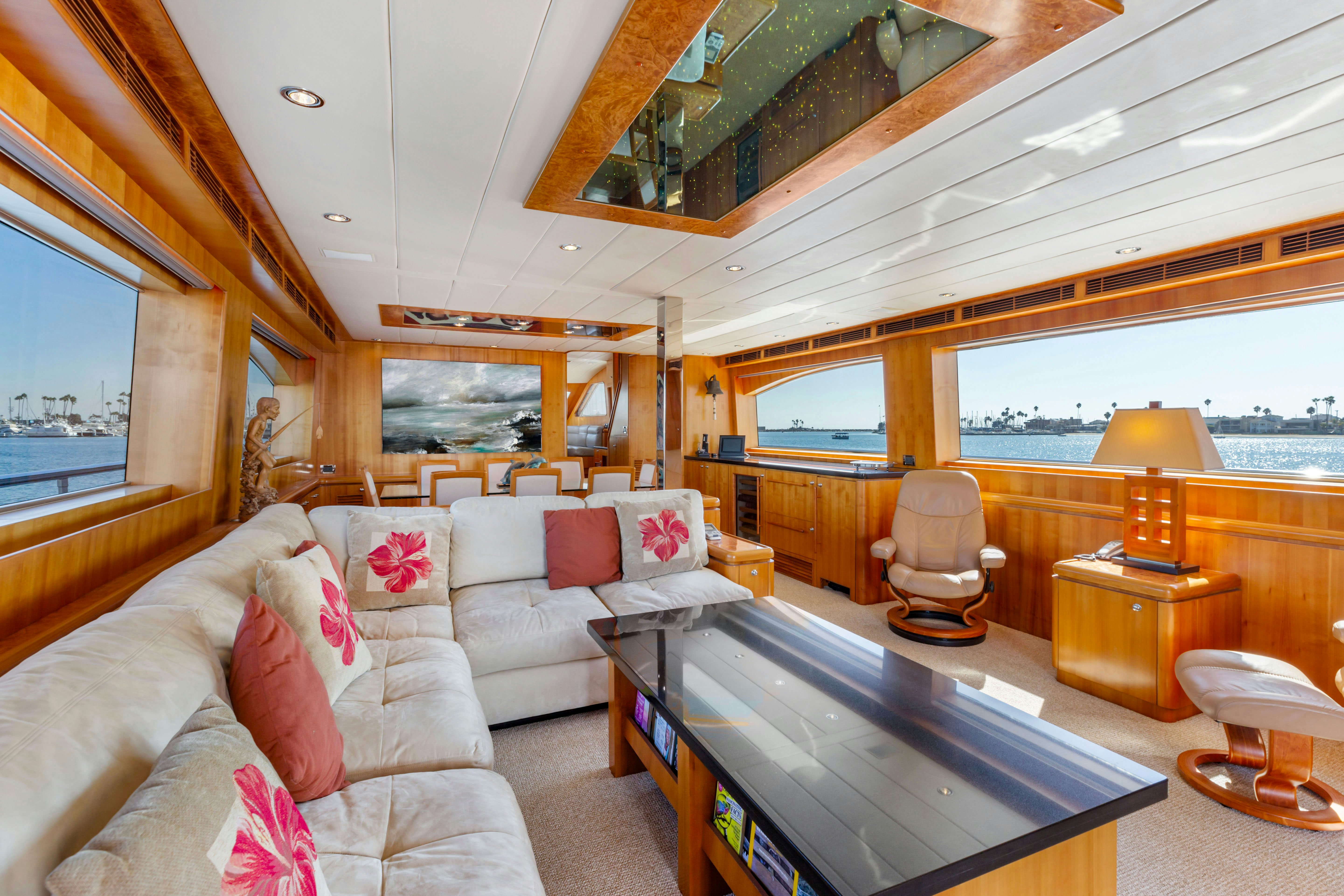 a living room with a large table aboard REVERIE Yacht for Sale