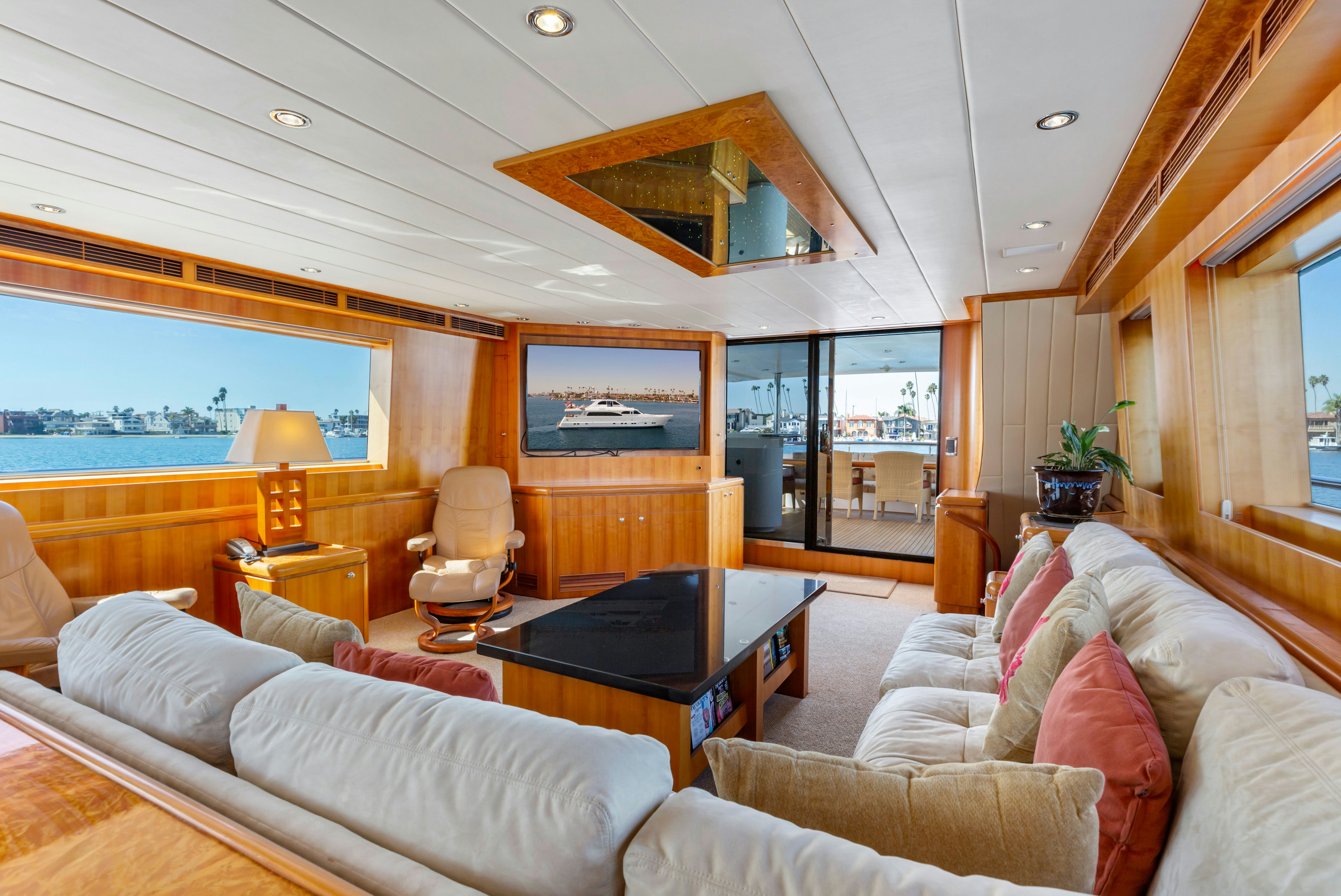 a living room with a large window aboard REVERIE Yacht for Sale