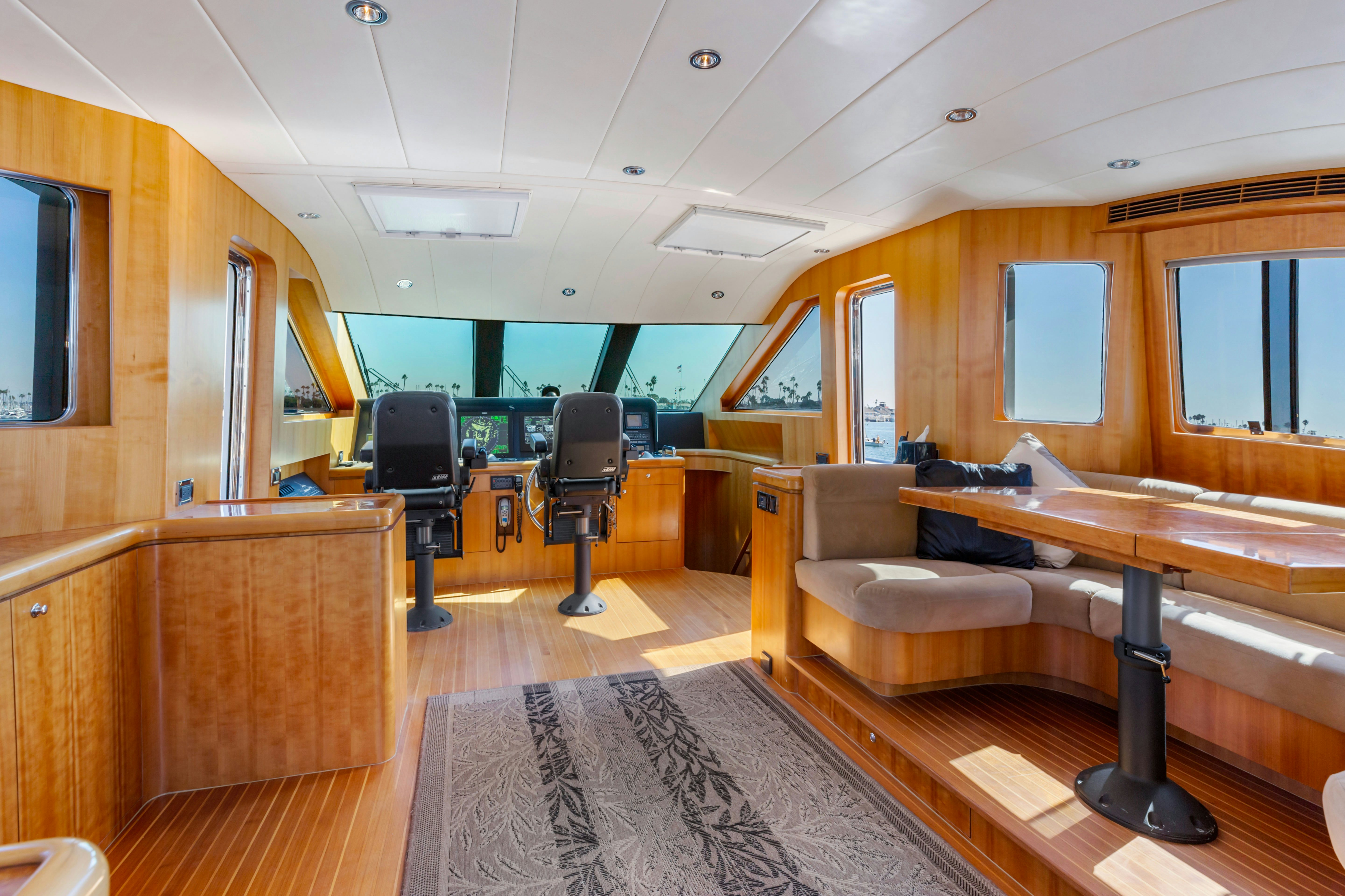 a room with a couch and a table and chairs aboard REVERIE Yacht for Sale