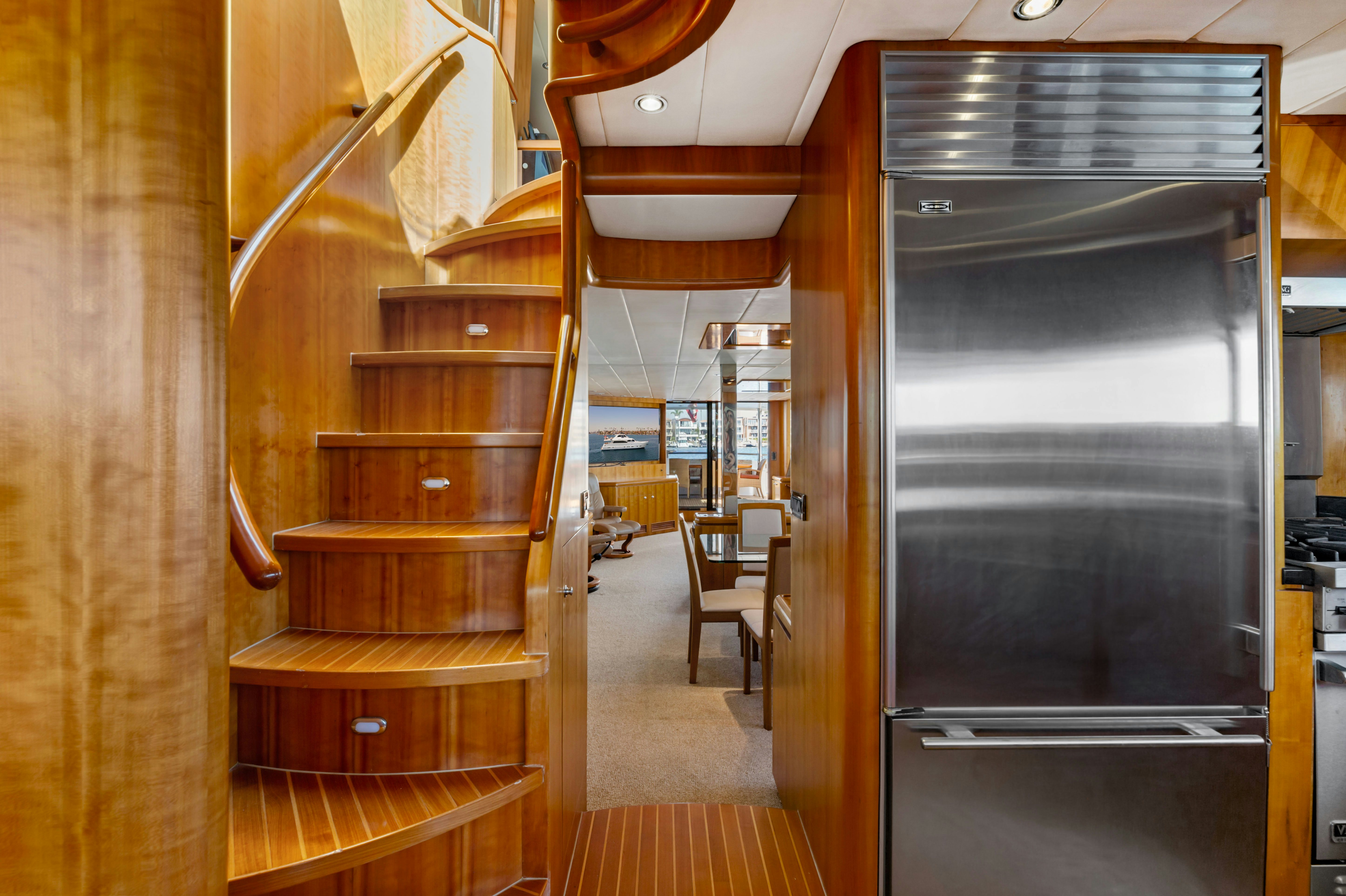 a room with wooden cabinets aboard REVERIE Yacht for Sale