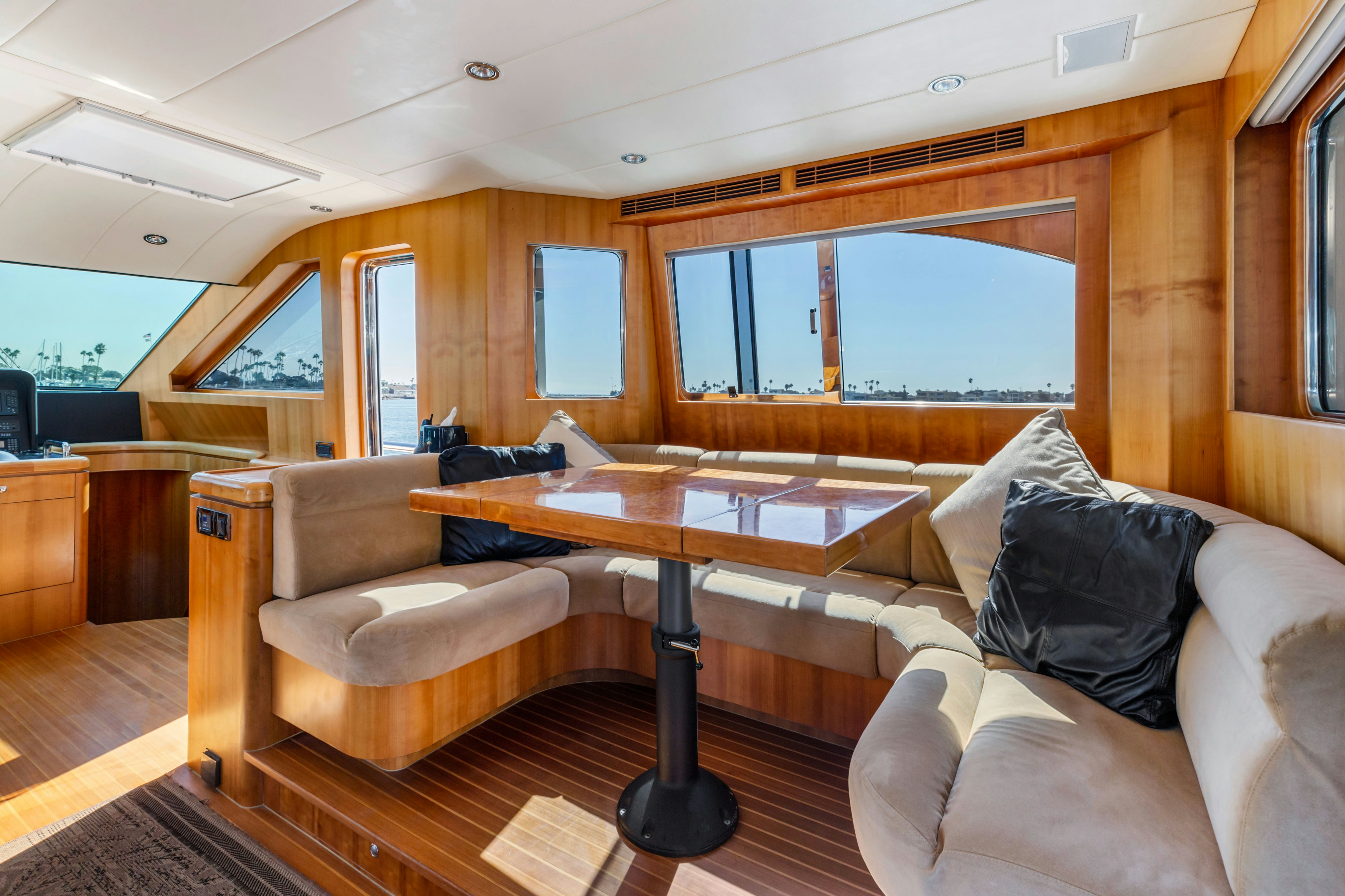 a living room with a couch and a table aboard REVERIE Yacht for Sale