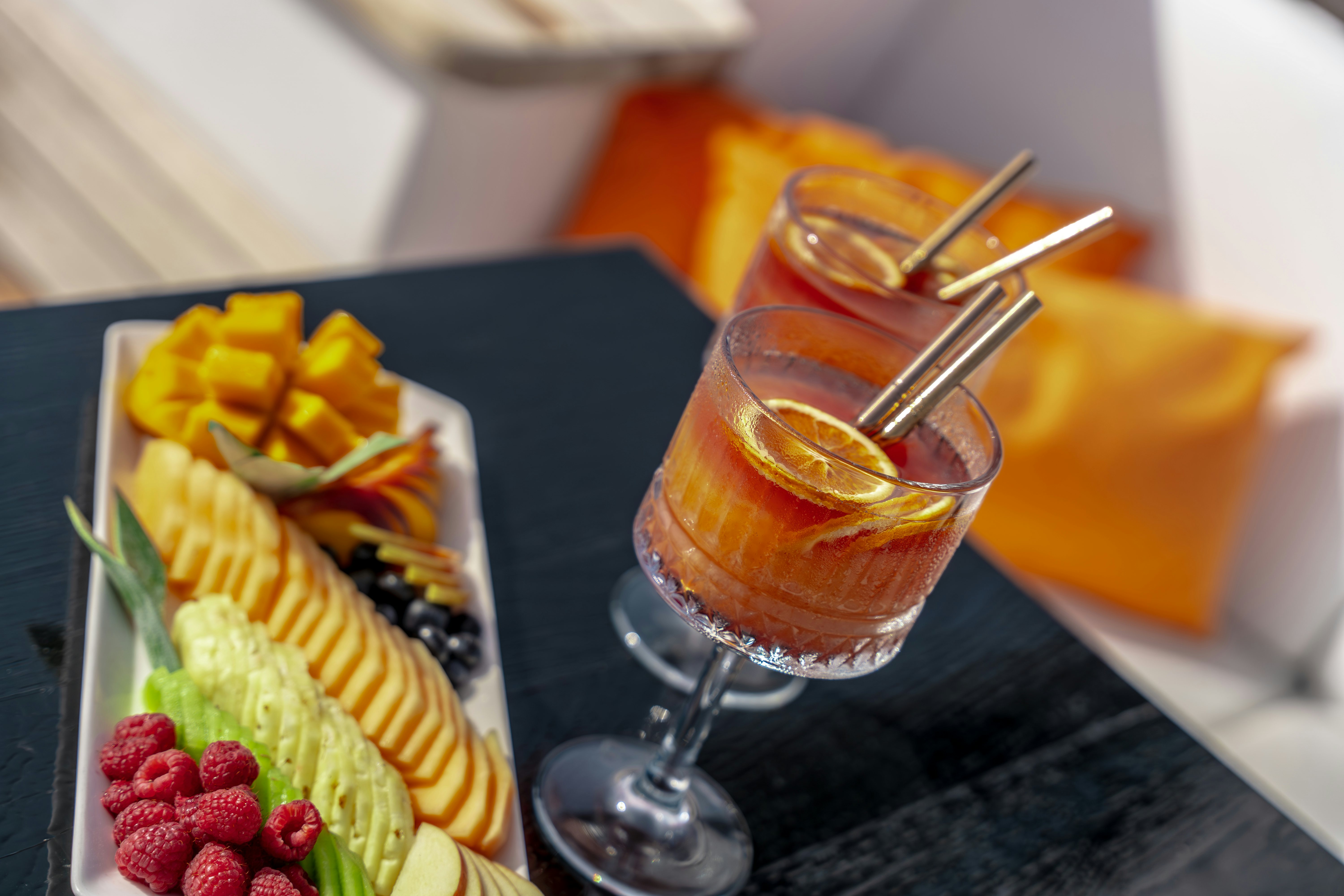 a plate of food and a glass of wine aboard SANTA CLARA Yacht for Charter