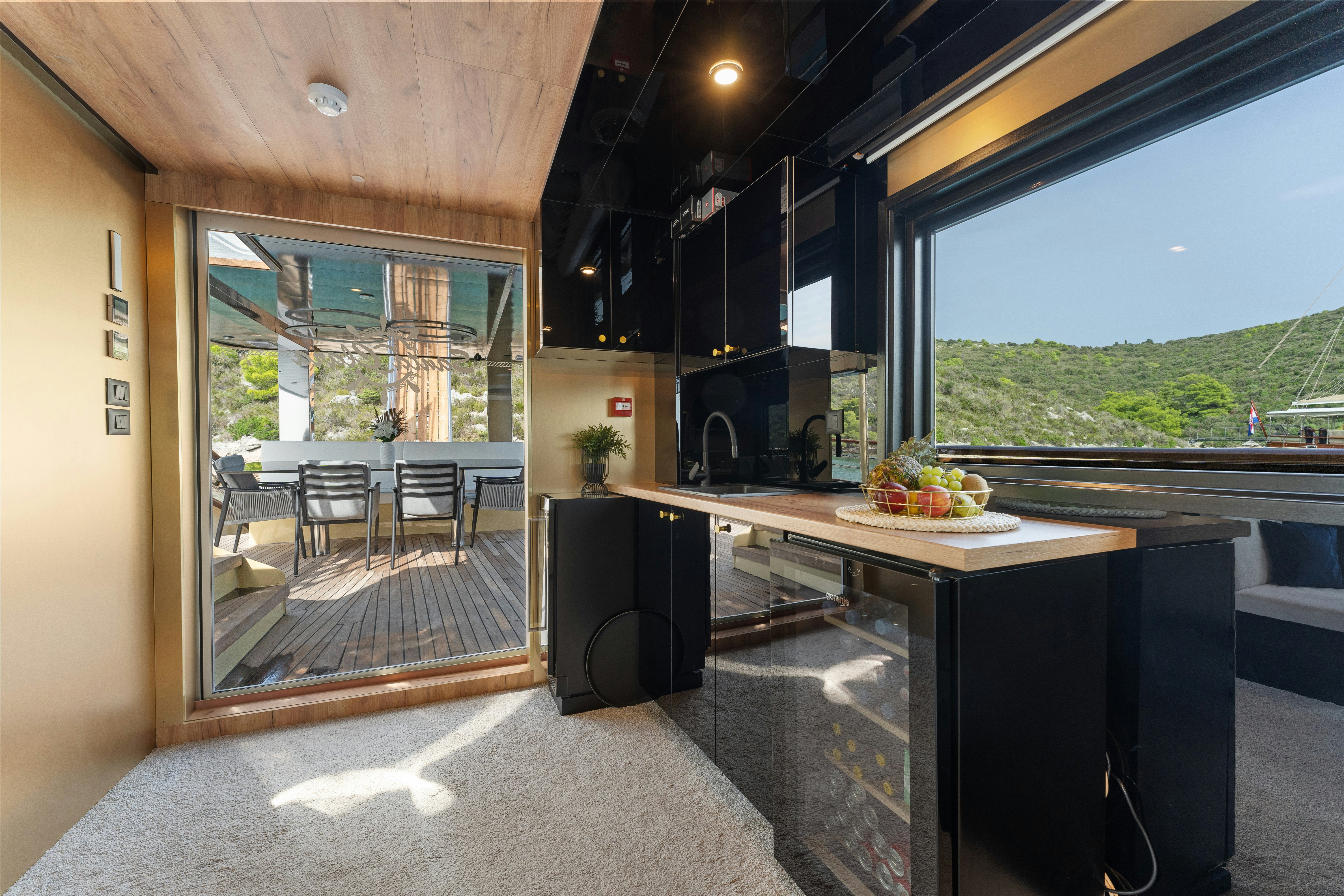 a kitchen with a large window aboard SANTA CLARA Yacht for Charter