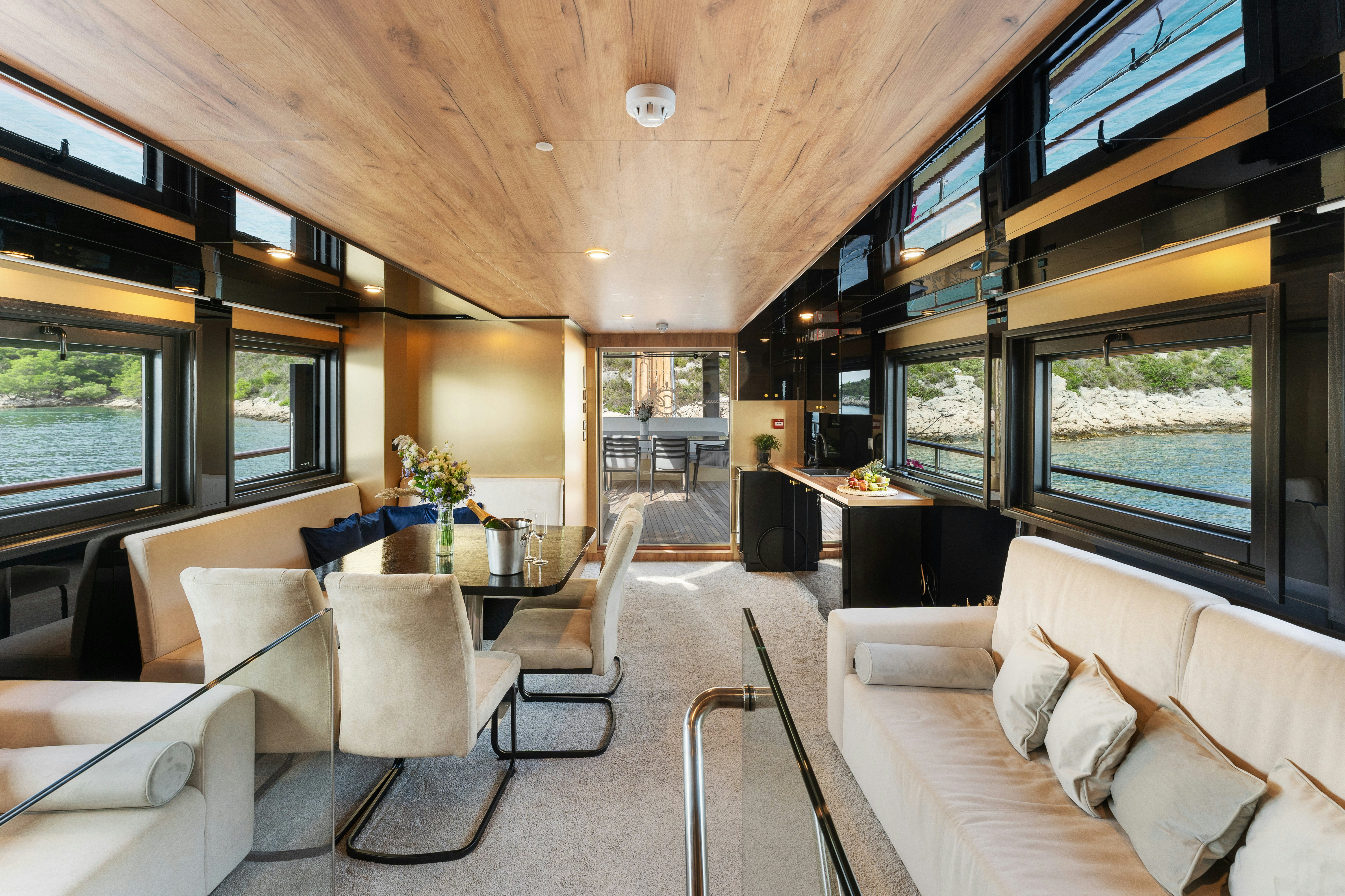 a living room with a large window aboard SANTA CLARA Yacht for Charter