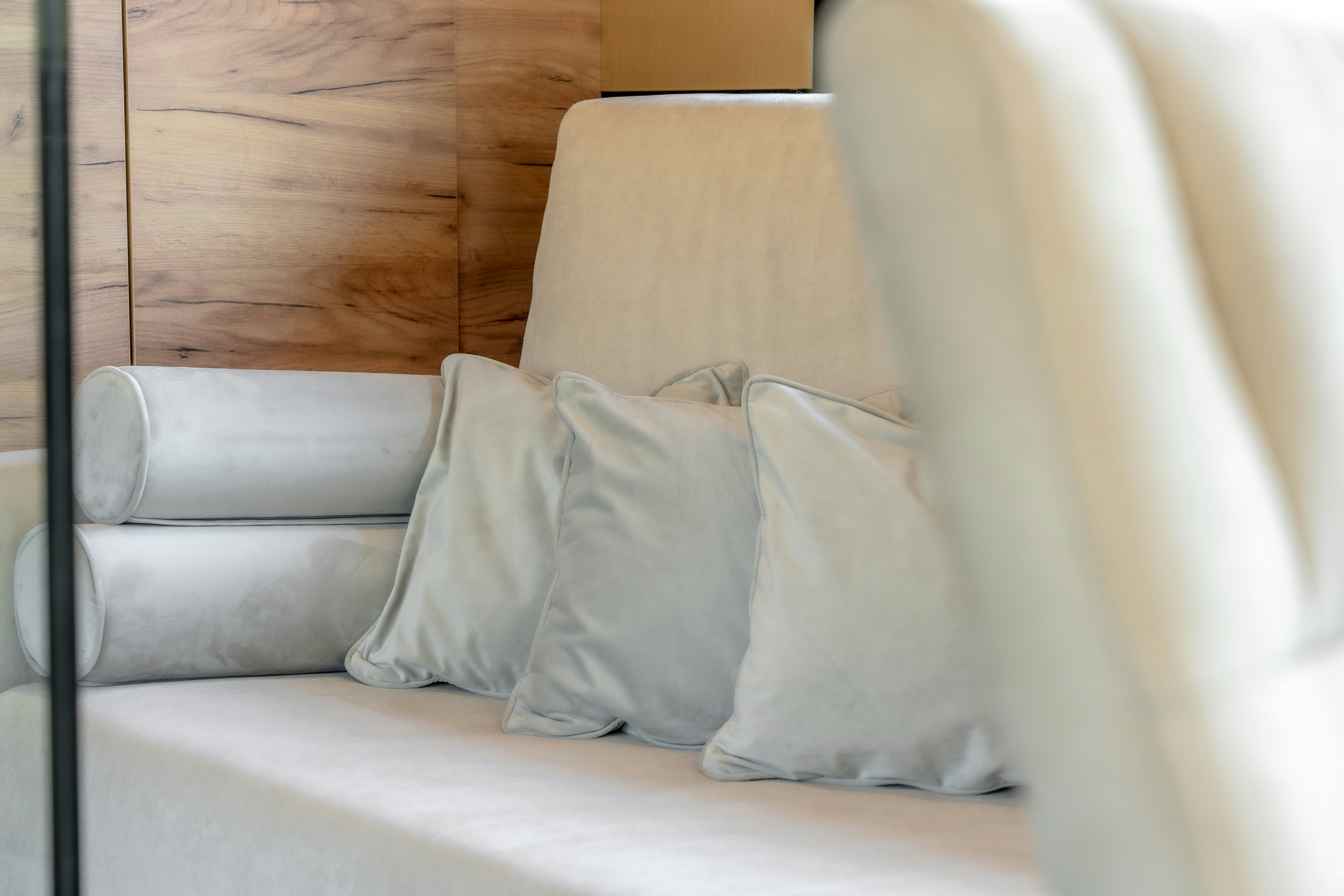 a couch with pillows aboard SANTA CLARA Yacht for Charter