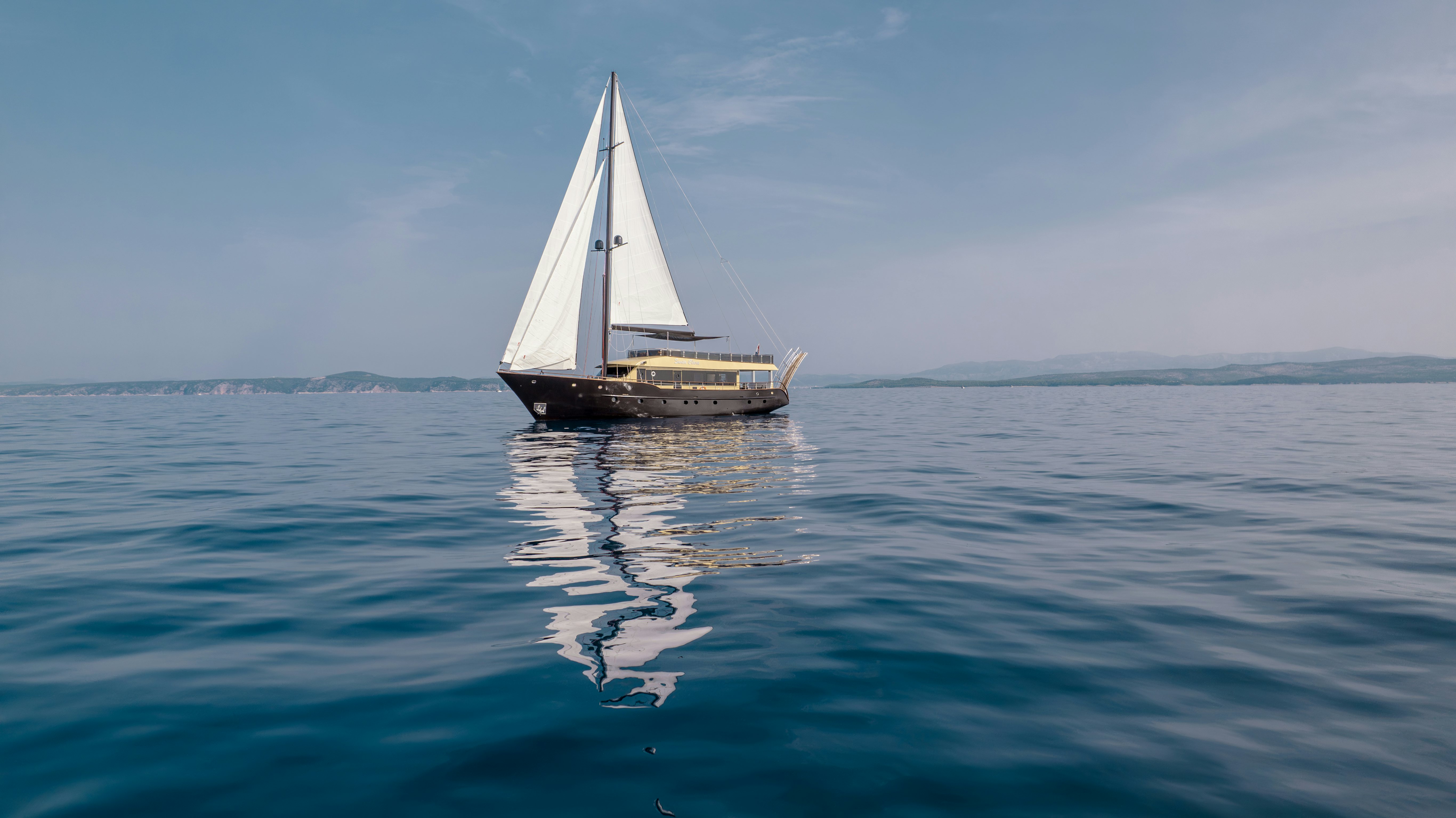 a sailboat in the water aboard SANTA CLARA Yacht for Charter