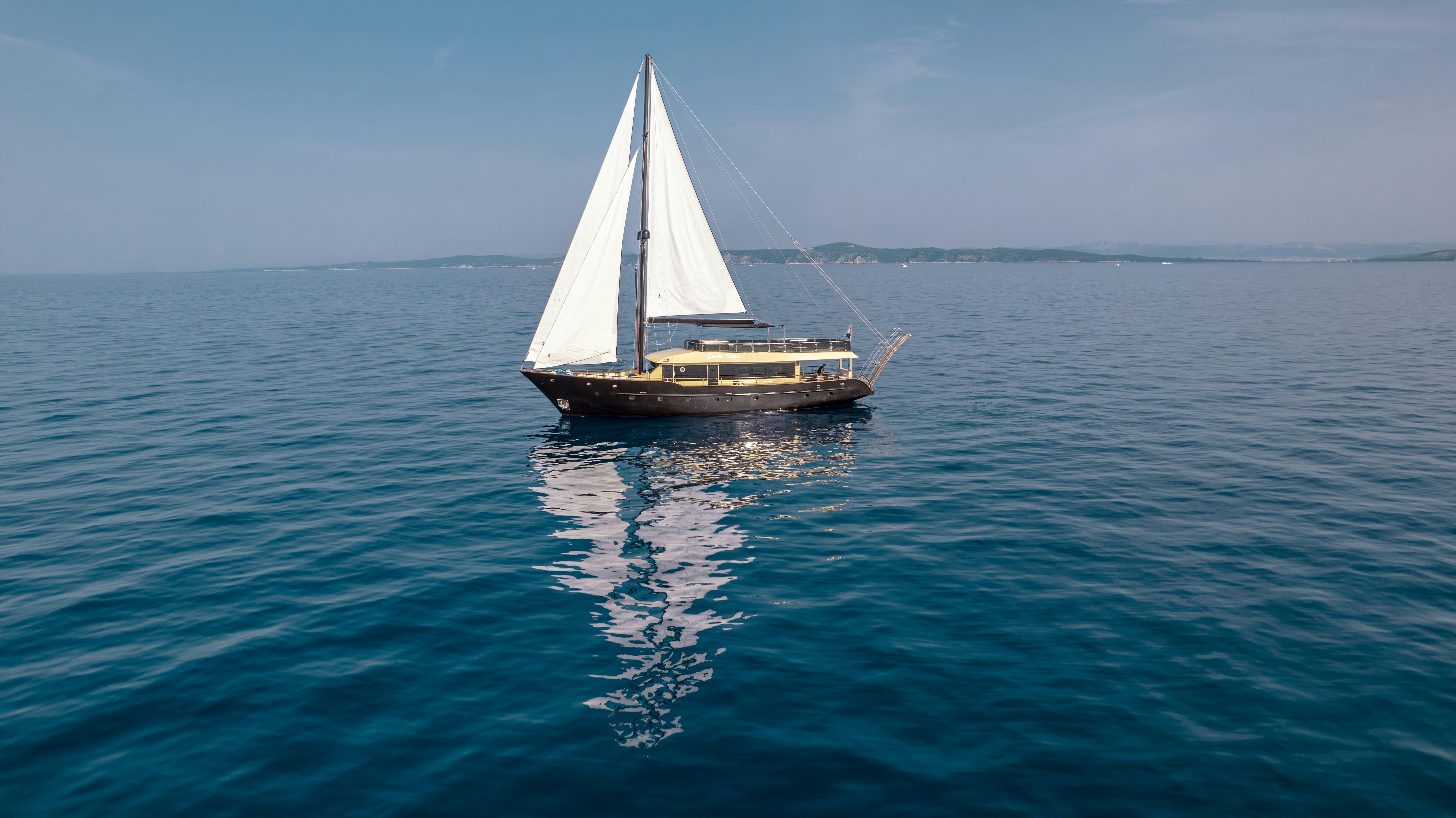 a sailboat in the water aboard SANTA CLARA Yacht for Charter