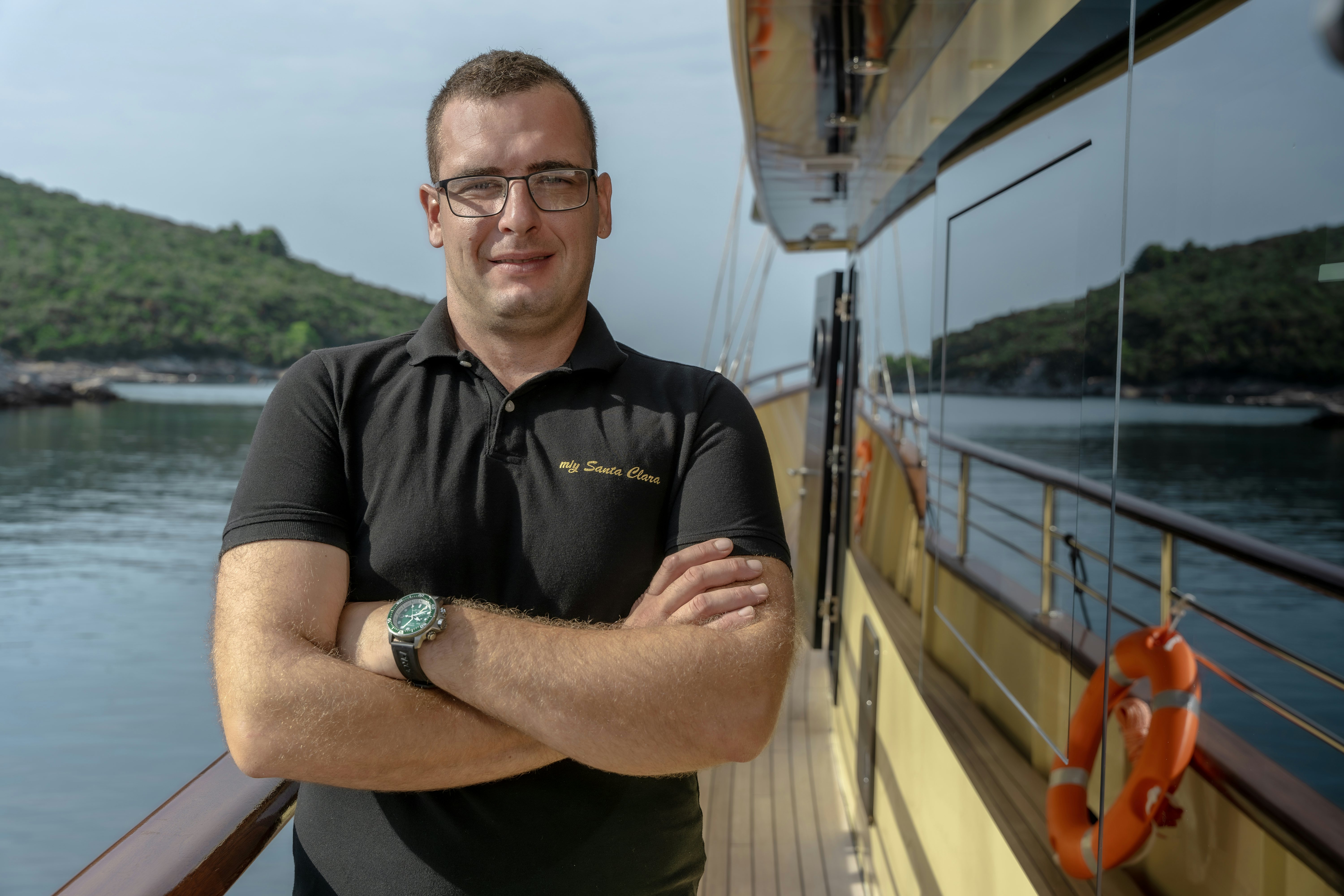 a man standing on a boat aboard SANTA CLARA Yacht for Charter