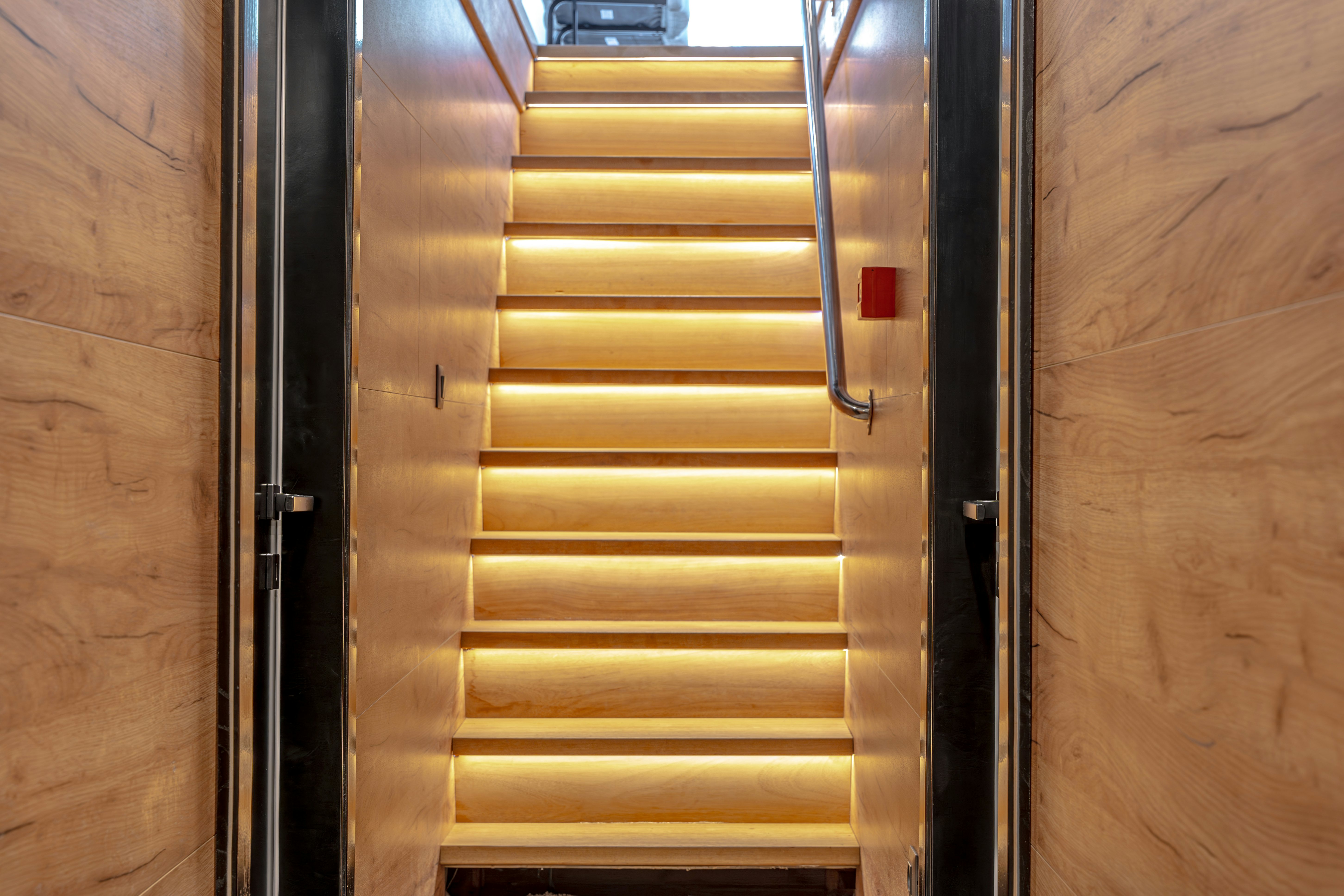 a wooden door with a red button aboard SANTA CLARA Yacht for Charter