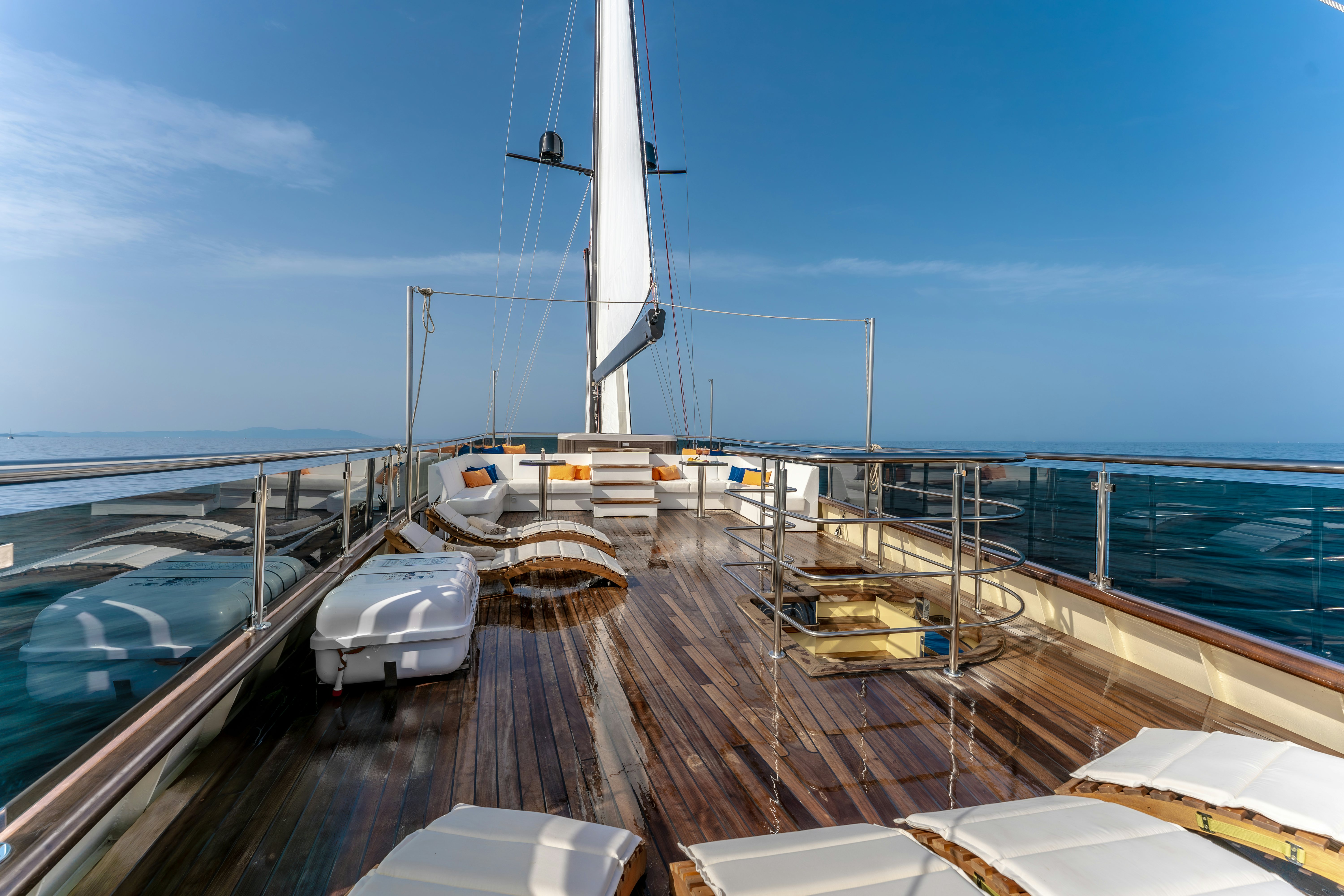 a wooden dock with boats aboard SANTA CLARA Yacht for Charter