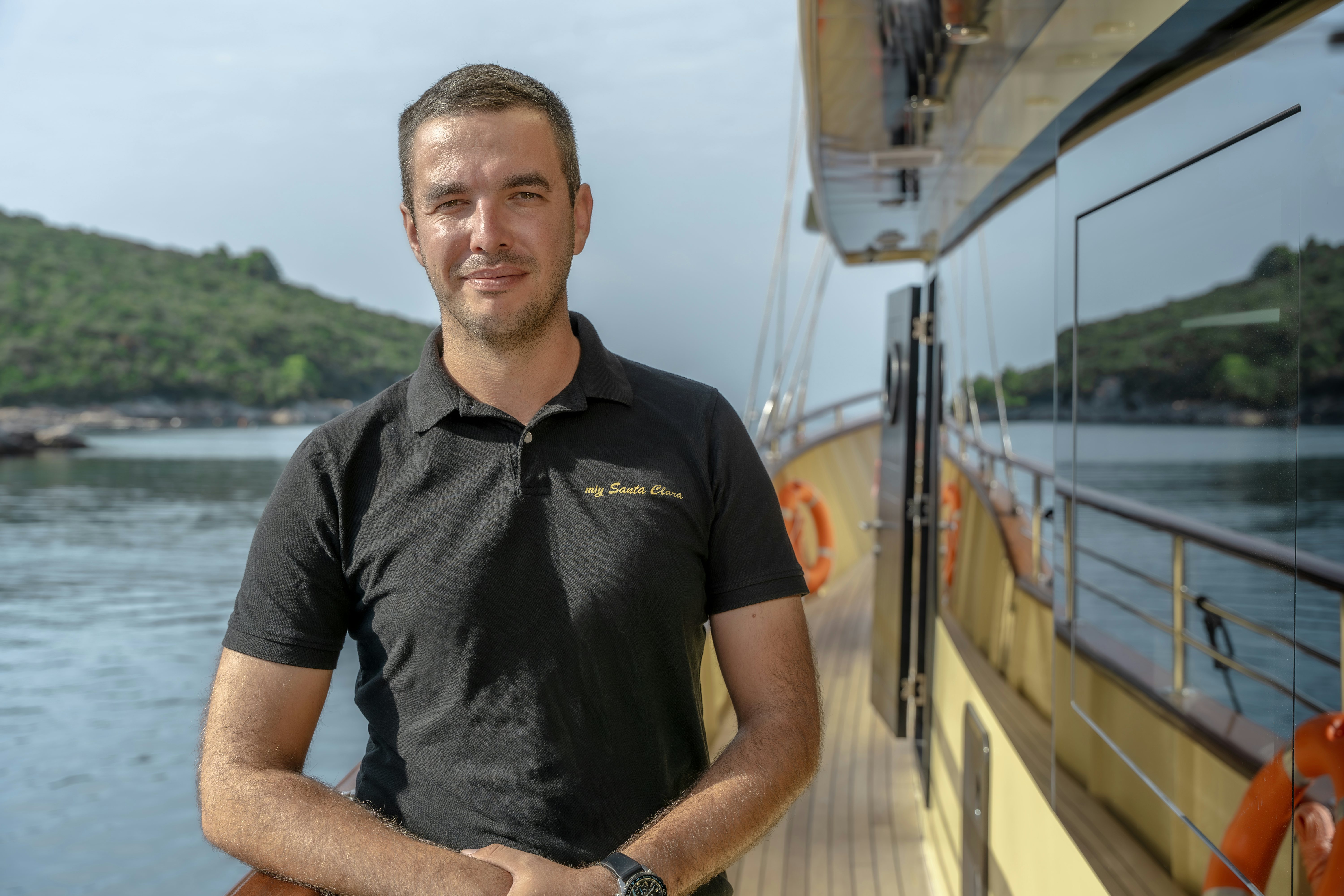 a man standing on a boat aboard SANTA CLARA Yacht for Charter