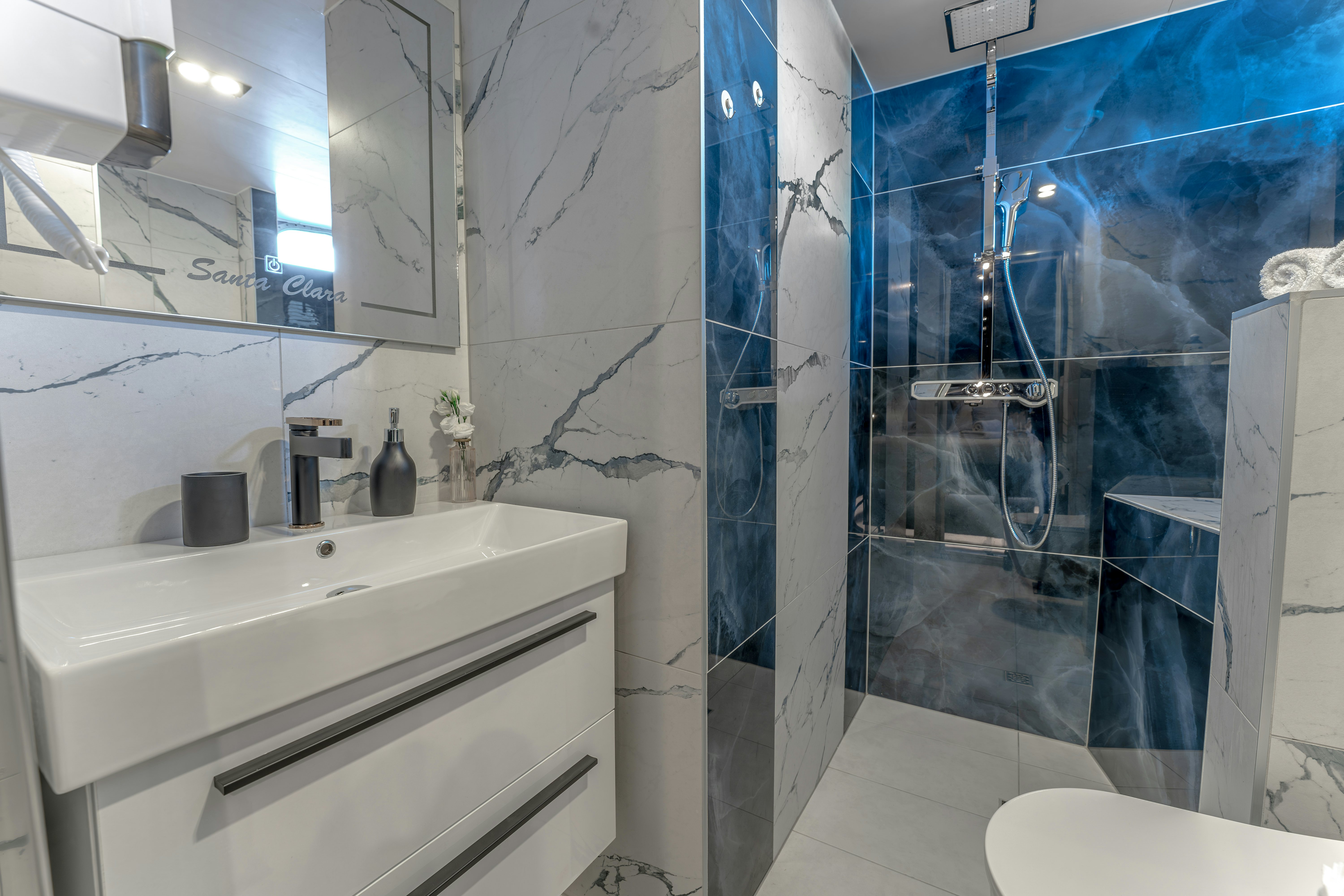 a bathroom with a shower and sink aboard SANTA CLARA Yacht for Charter