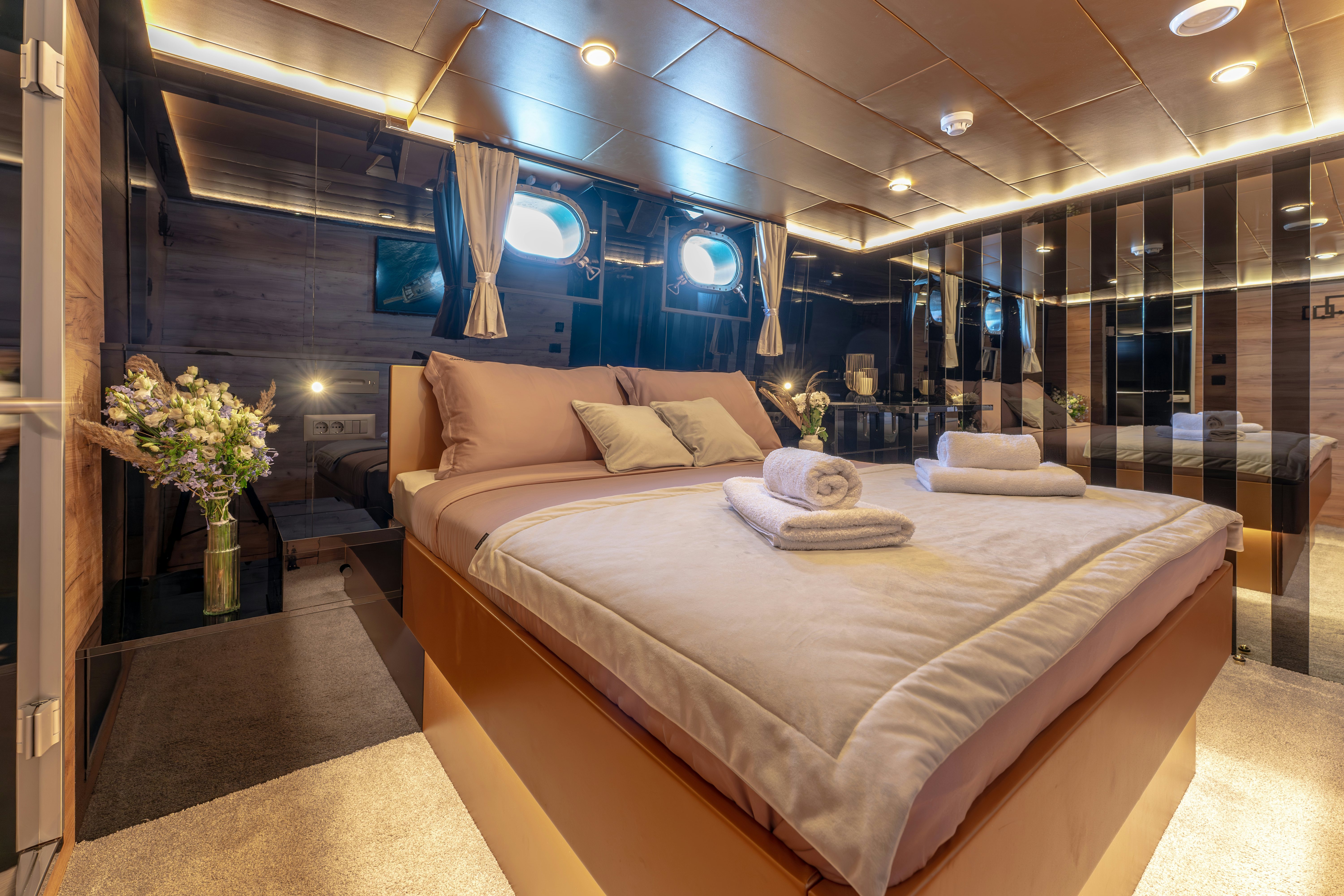 a bed in a room aboard SANTA CLARA Yacht for Charter