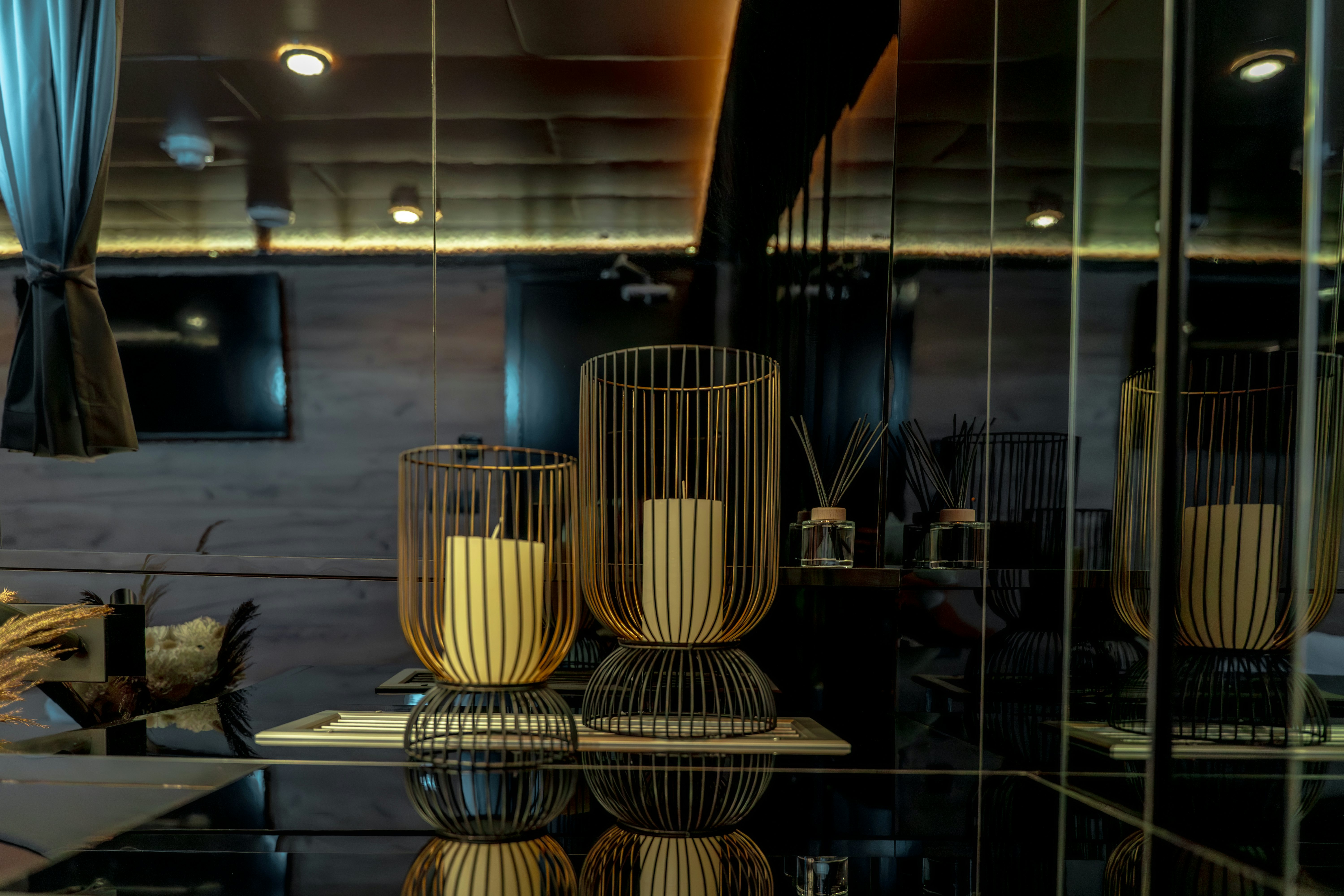 a glass display case with a few gold vases aboard SANTA CLARA Yacht for Charter