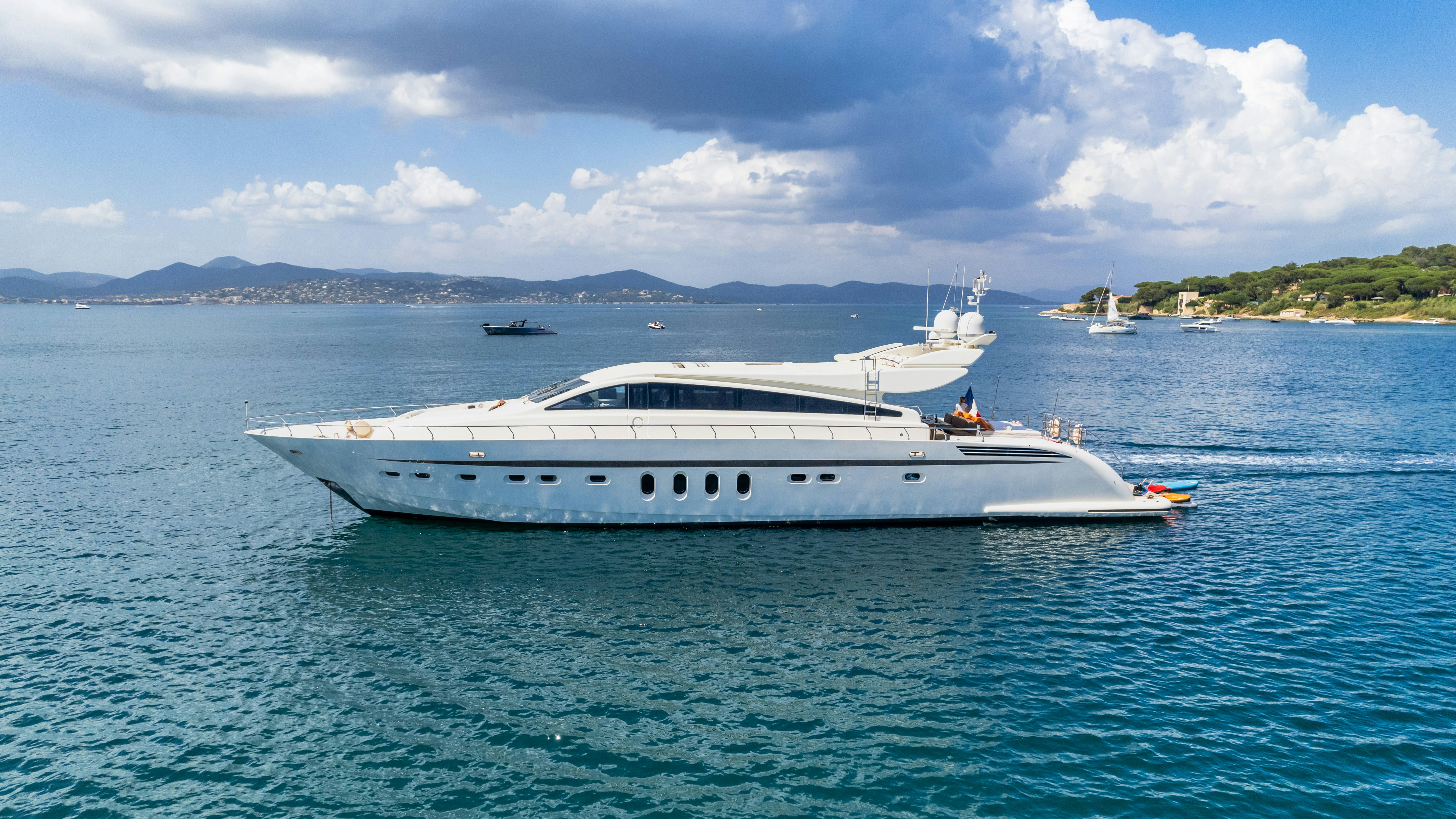 a white yacht in the water aboard ECLAT Yacht for Charter