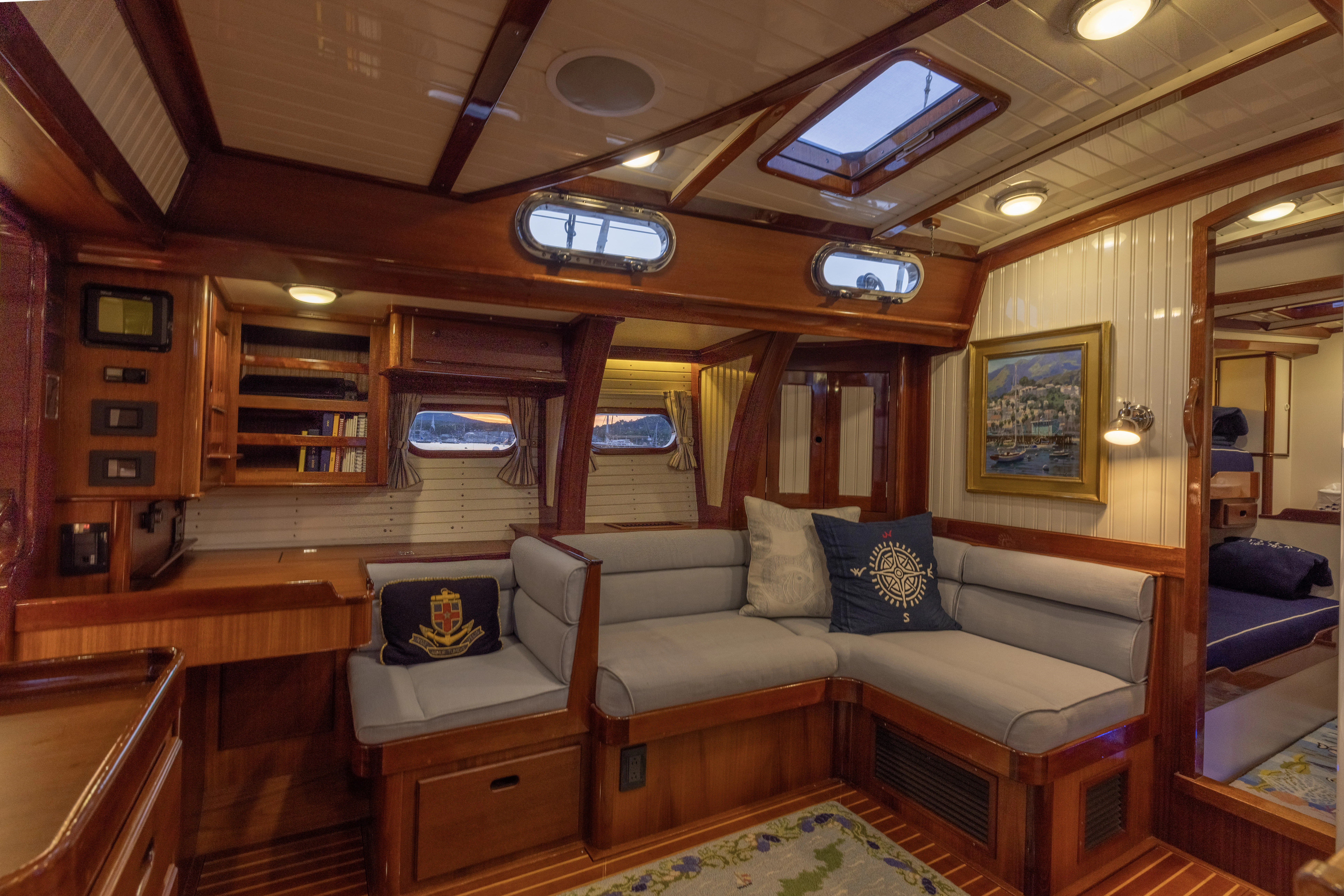 a living room with a couch and a table aboard MYSTERY Yacht for Sale