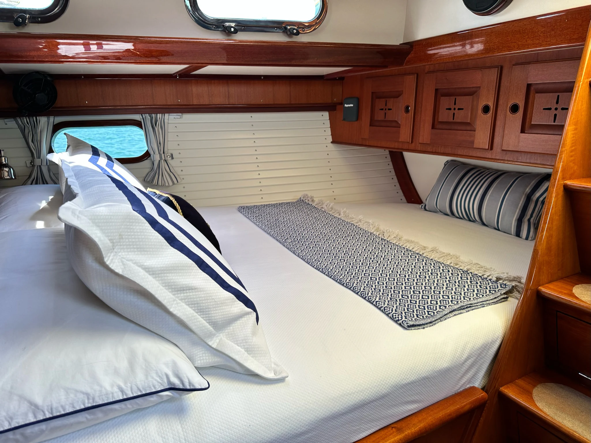 a bed with white sheets aboard MYSTERY Yacht for Sale