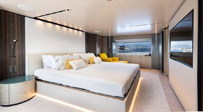 a large bedroom with a bed aboard HAIAMI I Yacht for Charter
