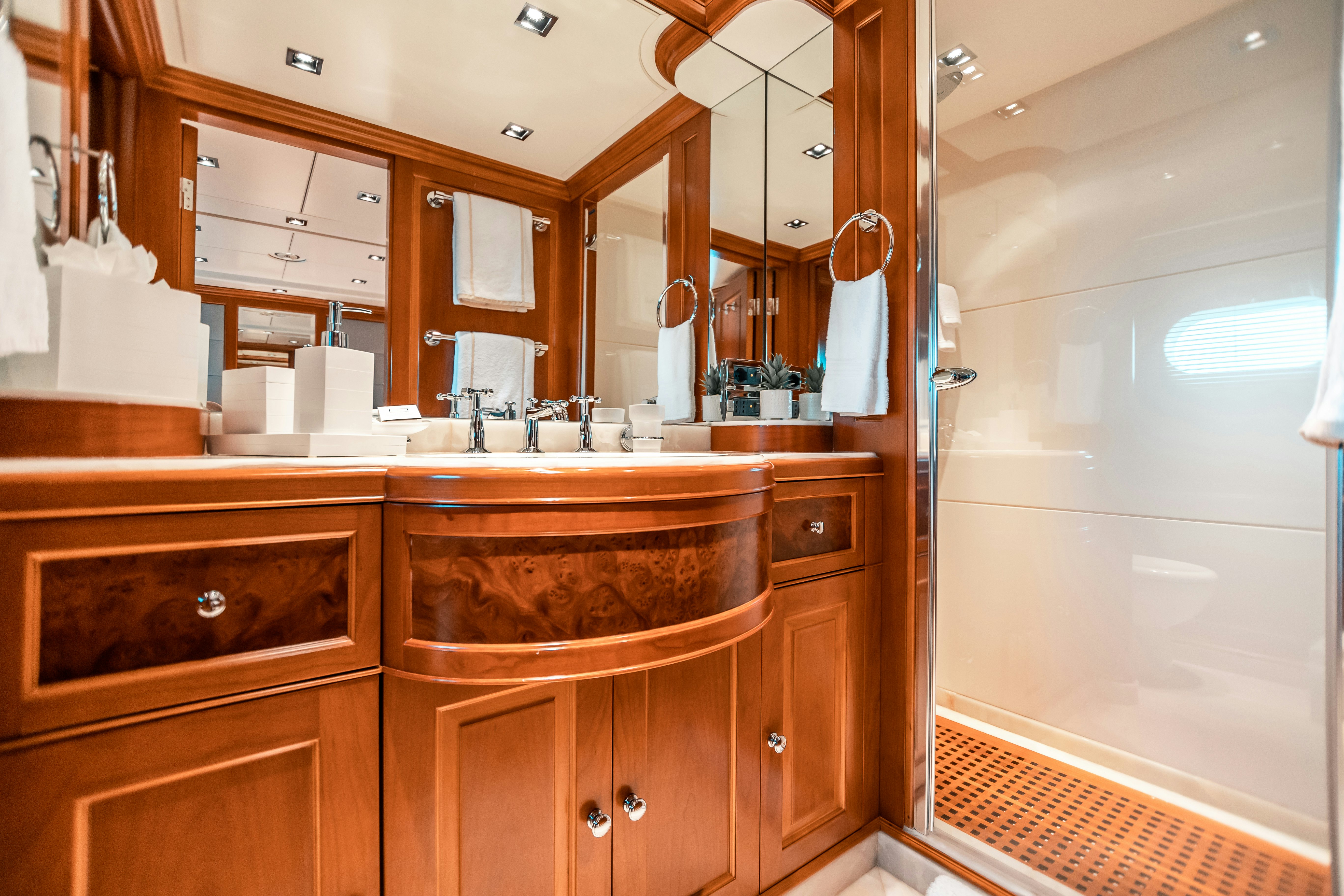 a bathroom with a large mirror aboard ARTHUR’S WAY Yacht for Charter